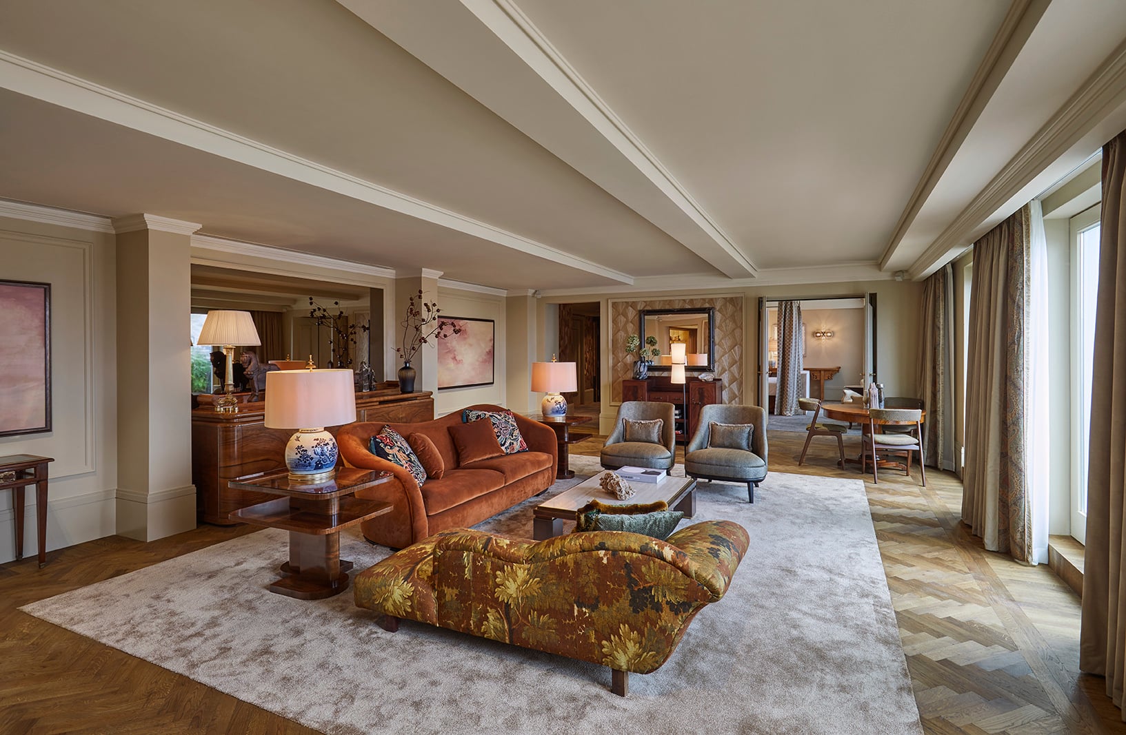 The Royal Penthouse Suite living room with panoramic views of the Amstel River and Muntplein