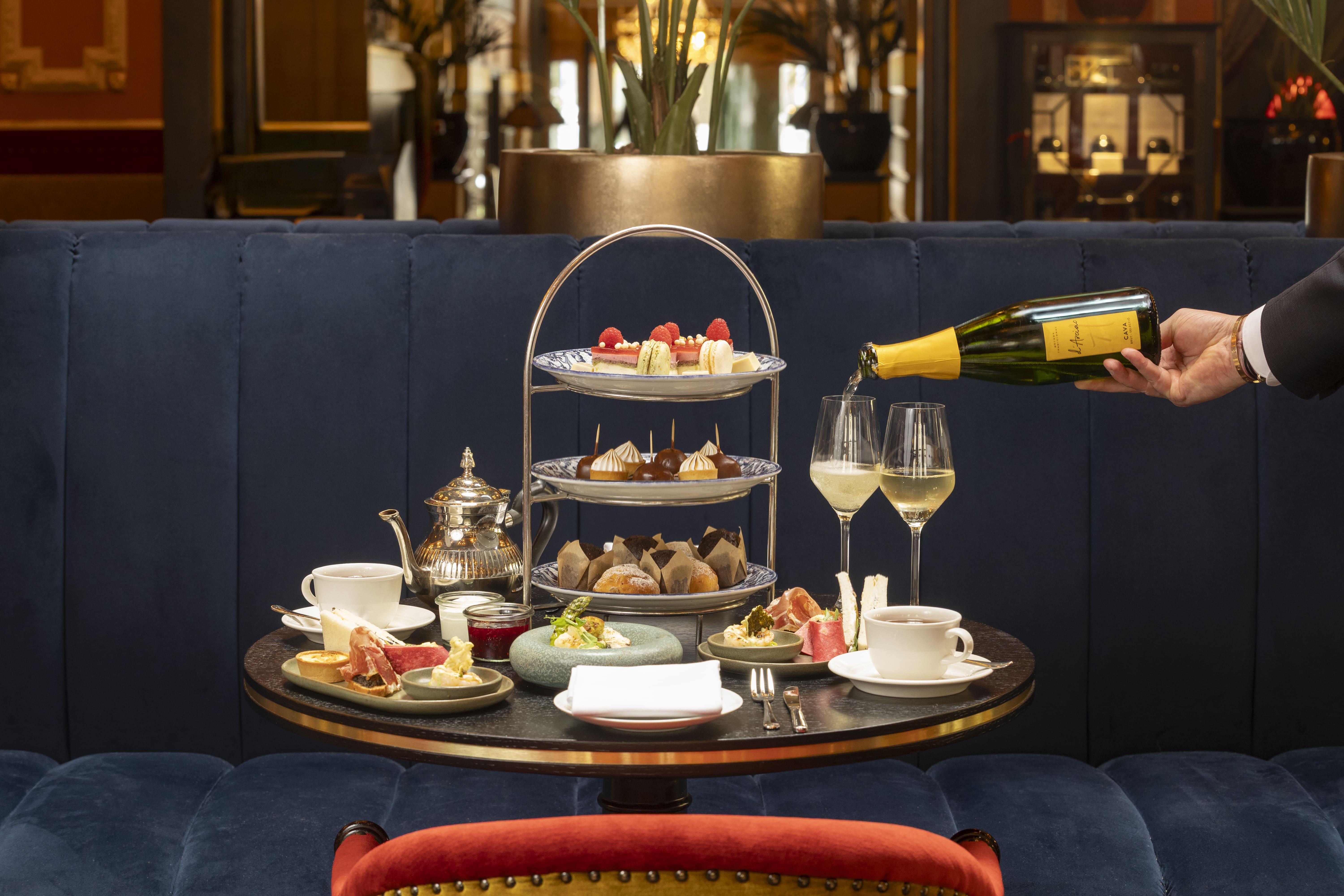 The legendary Royal High Tea served under the grand crystal chandelier in the Des Indes Lounge