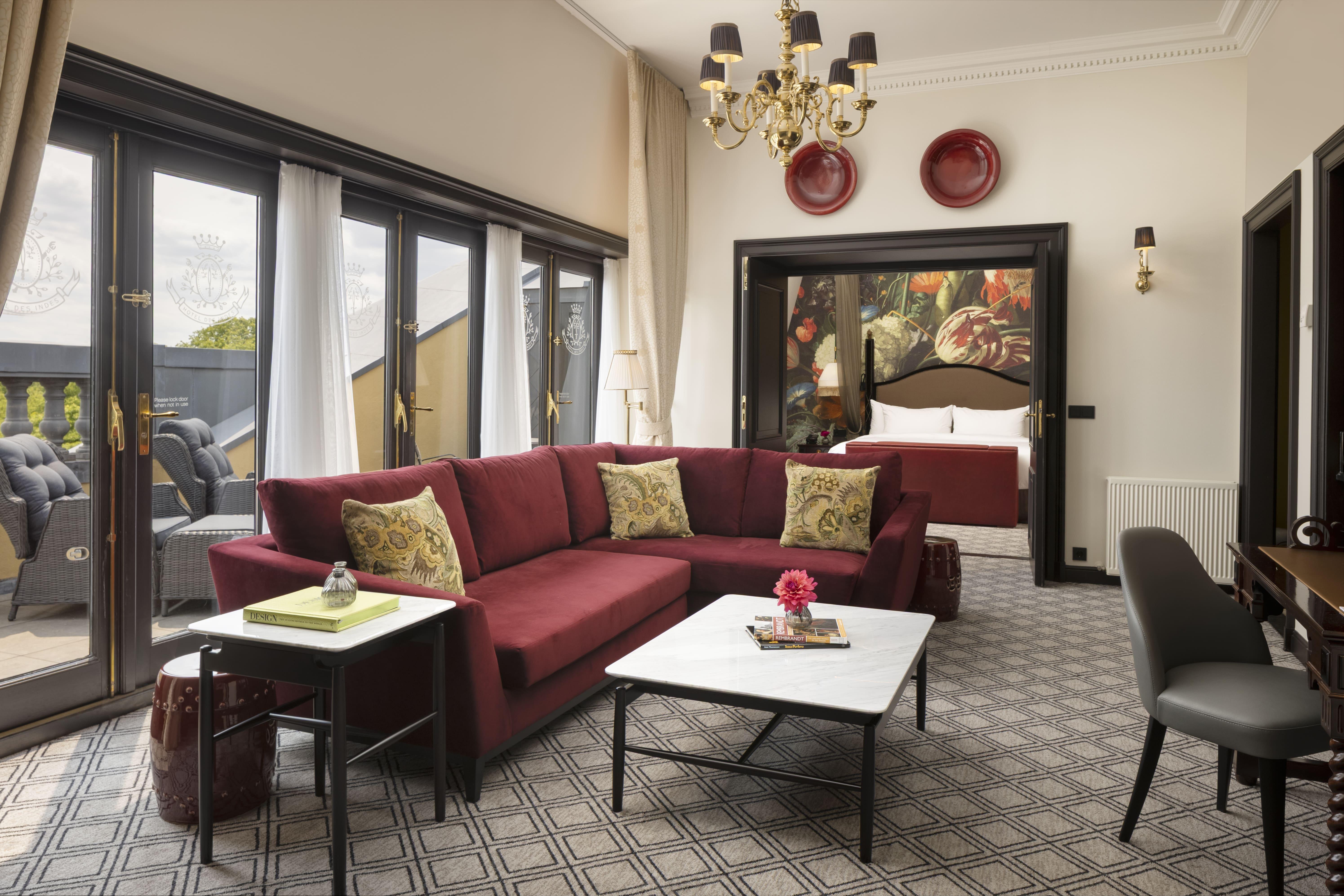 The opulent Presidential Suite with gilded salon, historic oil paintings, and canopy bed