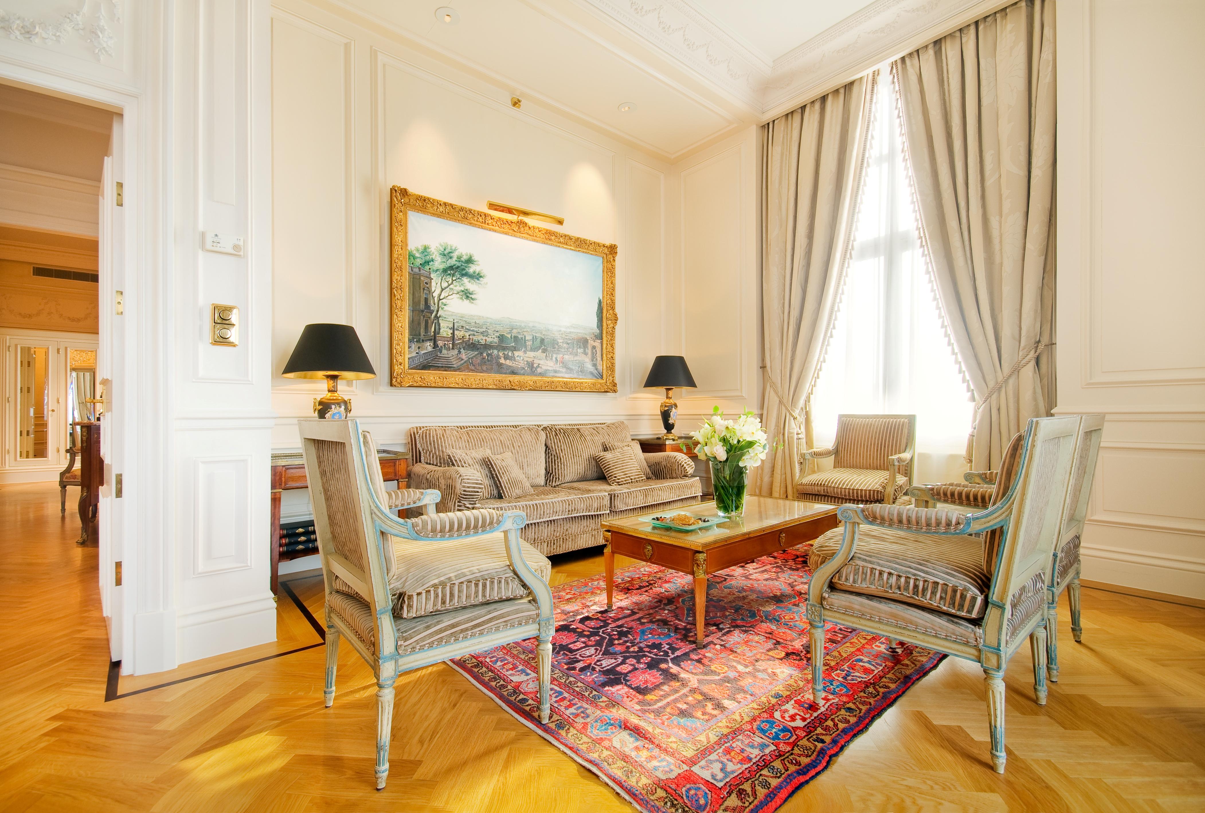 Palatial living salon of the Royal Suite featuring French period decor and panoramic river views