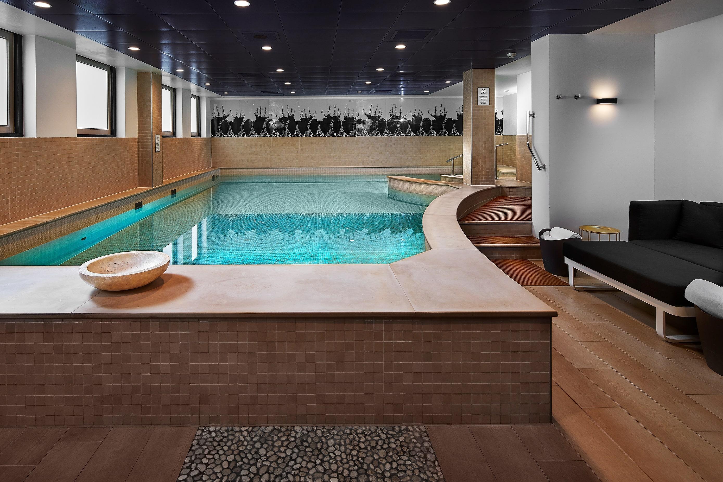 Sofitel SPA relaxation zone featuring heated indoor swimming pool, Turkish hammam, and sauna