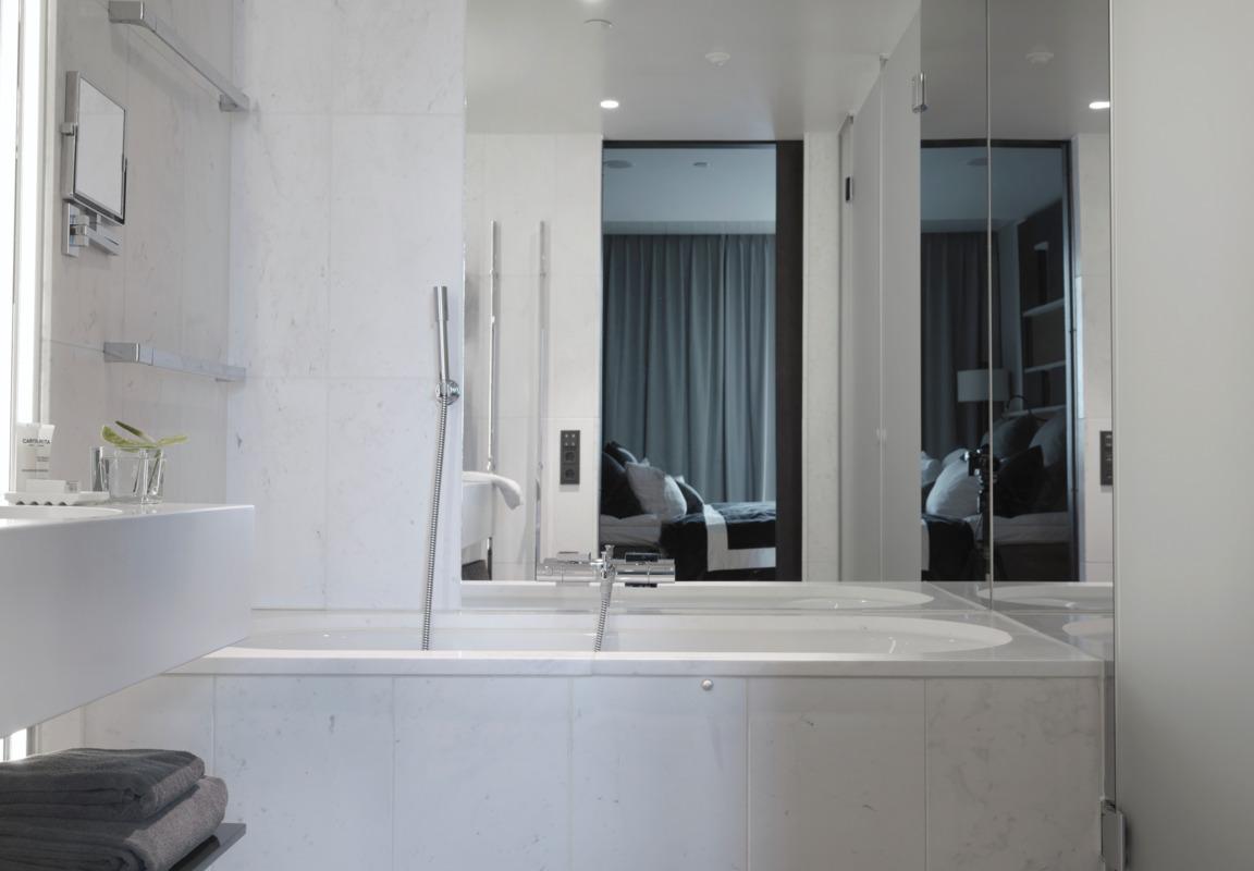 Executive Suite Spa Bathroom with Deep Soaking Tub and Rain Shower