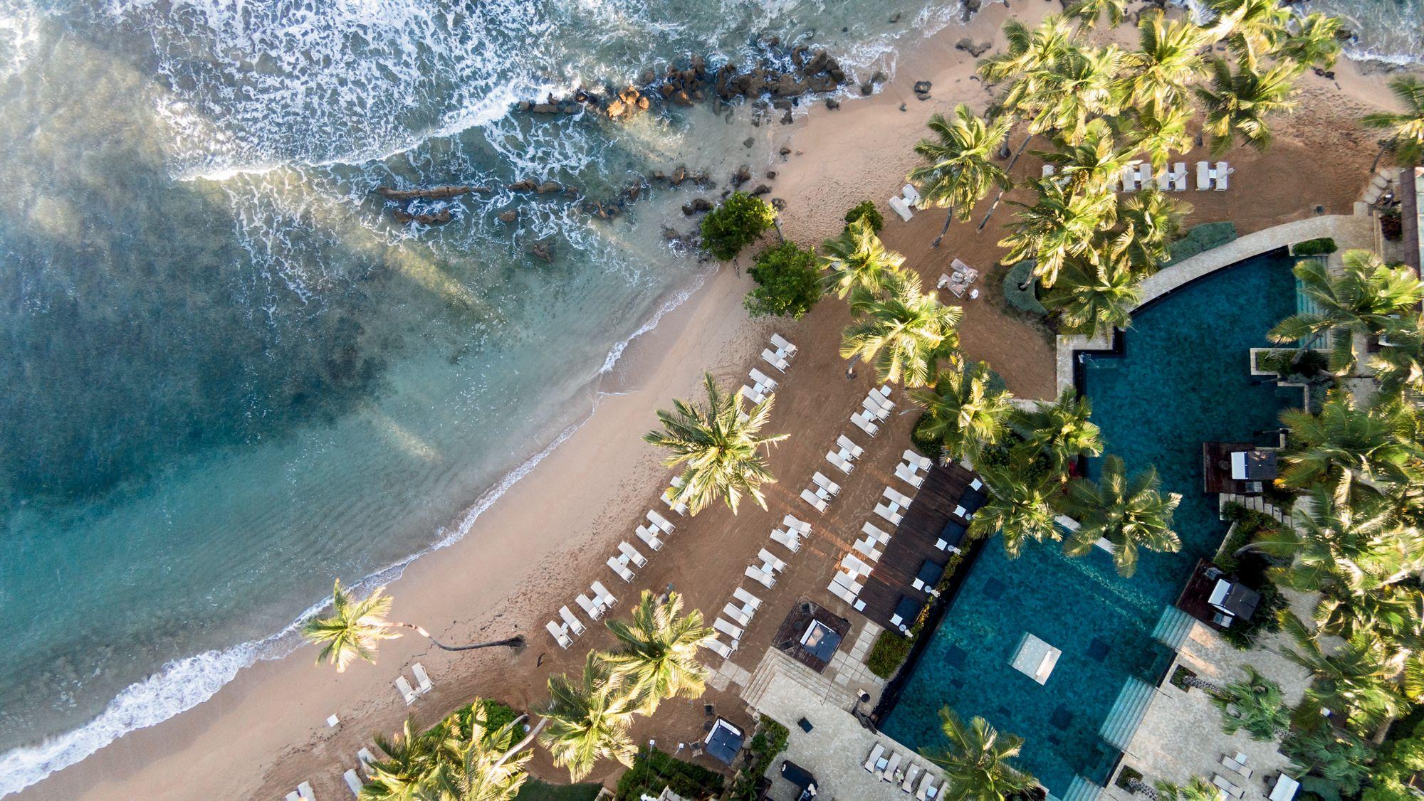Dorado Beach a Ritz-Carlton Reserve aerial panoramic overview of coastline and lush sanctuary