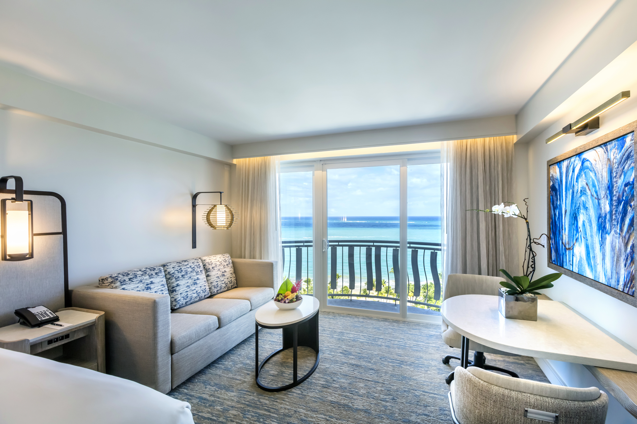 Private penthouse balcony framing panoramic sunset vistas of Isla Verde Beach and rolling Atlantic waves