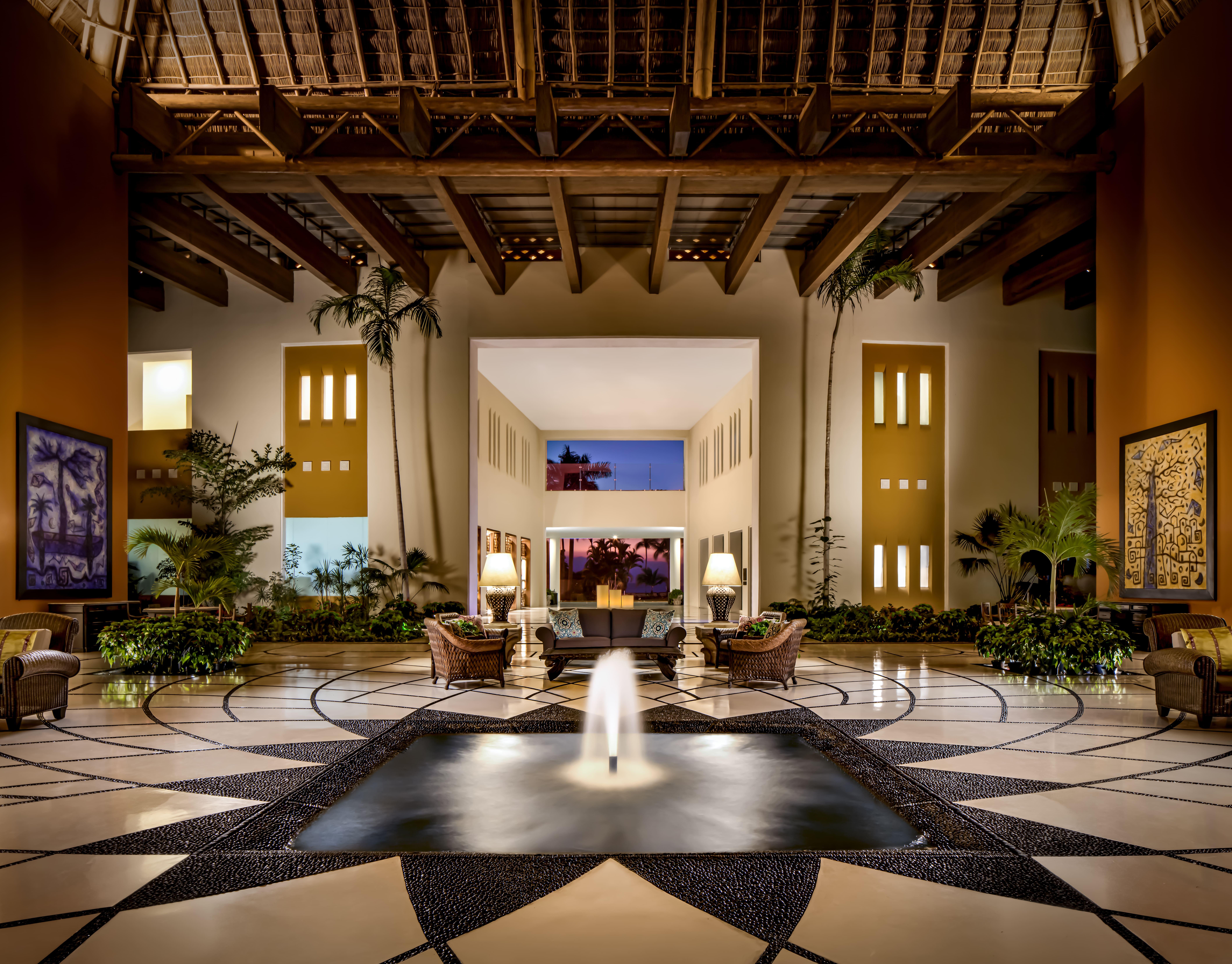 Grand open-air palapa lobby entrance