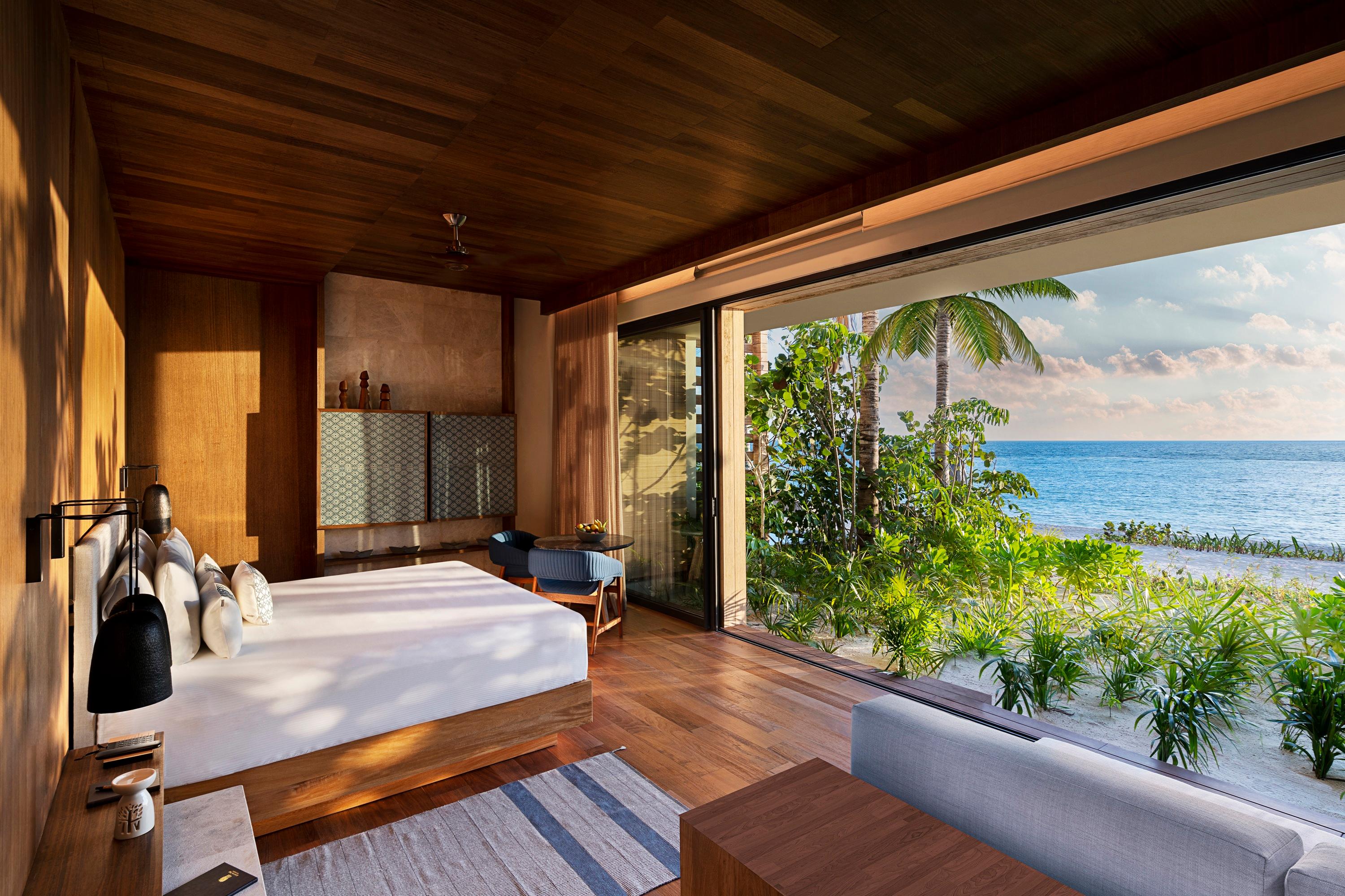 Beachfront Terrace Pool Suite master bedroom opening to ocean deck