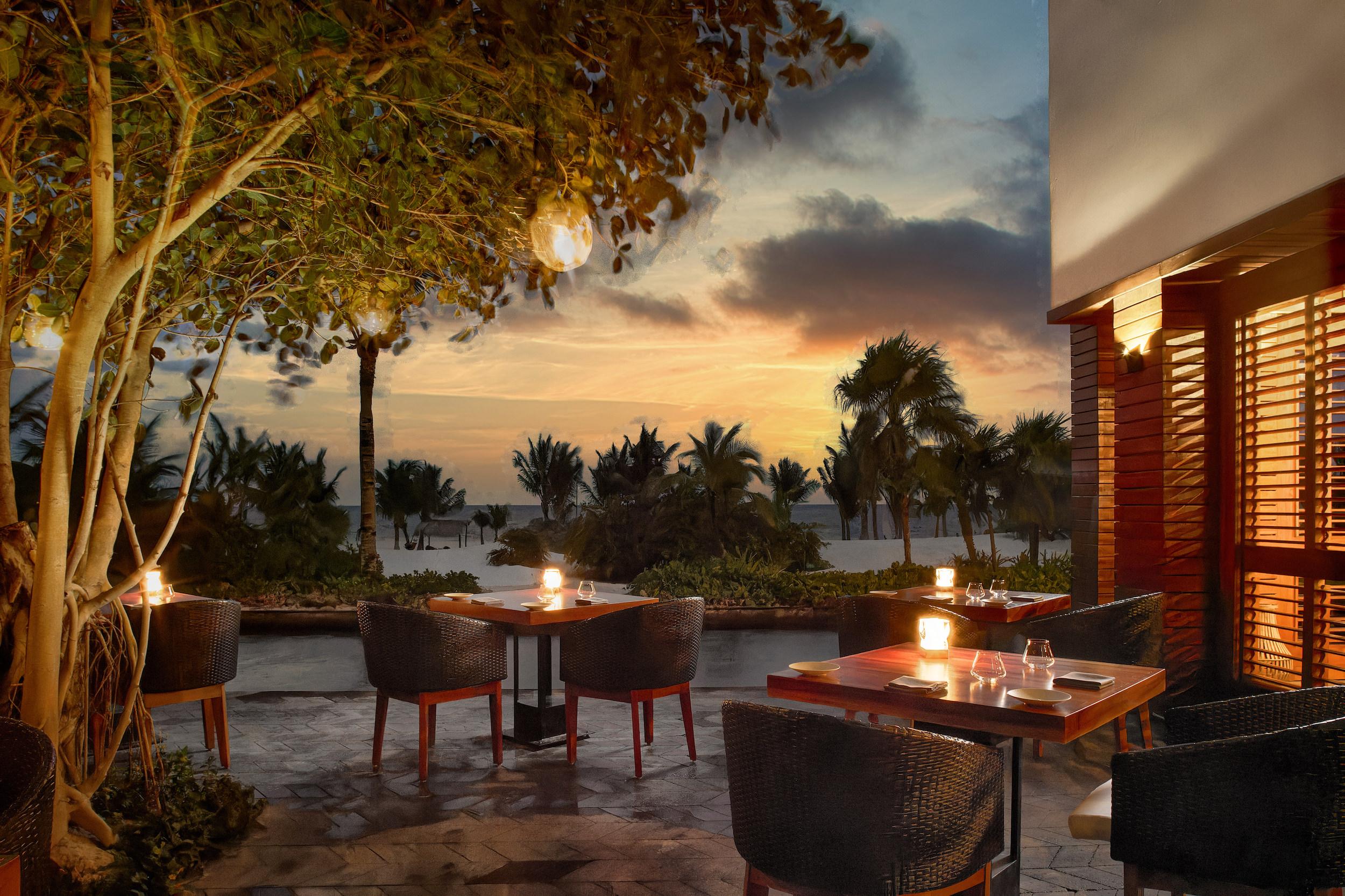 Bu'ul restaurant dining terrace illuminated under starry night sky