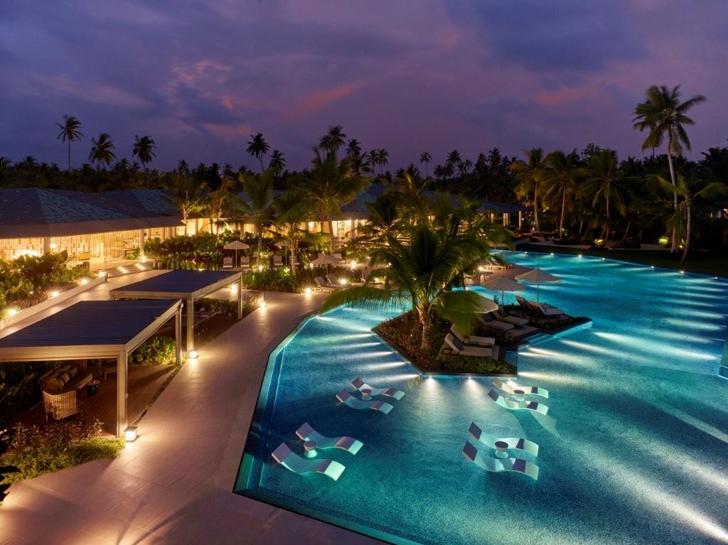 Illuminated Main Resort Infinity Pool at Night