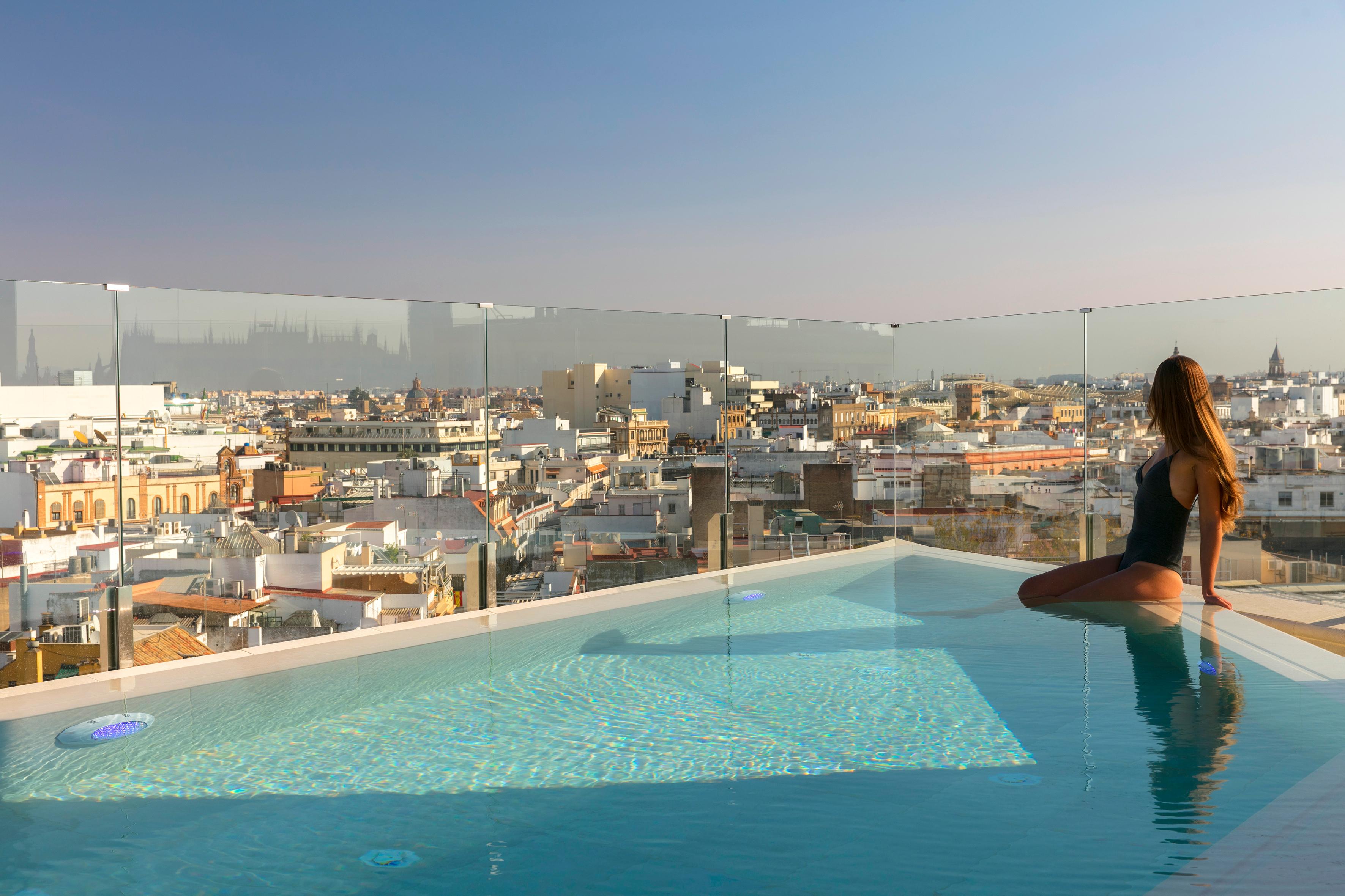 Rooftop swimming pool and solarium terrace overlooking Seville