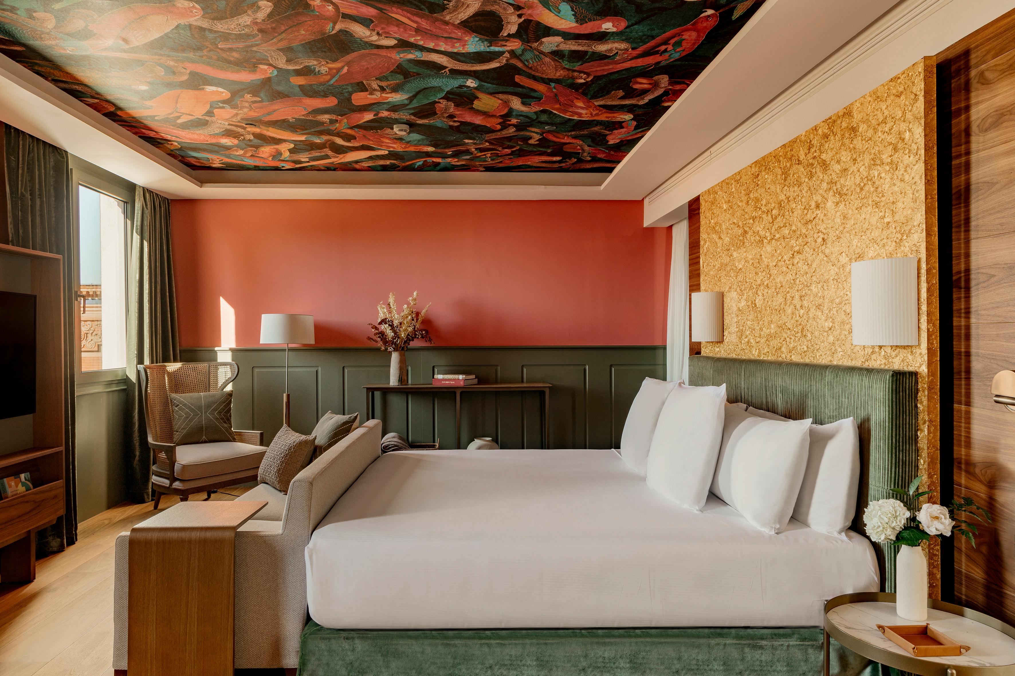 RedLevel Suite living area framing panoramic views of Seville Cathedral