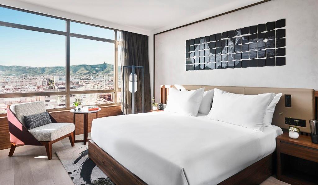 Premium Skyline guestroom with panoramic window and Japanese minimalist decor