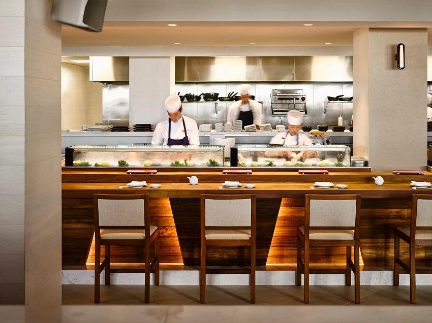 Master sushi chefs crafting signature Japanese-Peruvian dishes at Nobu Restaurant