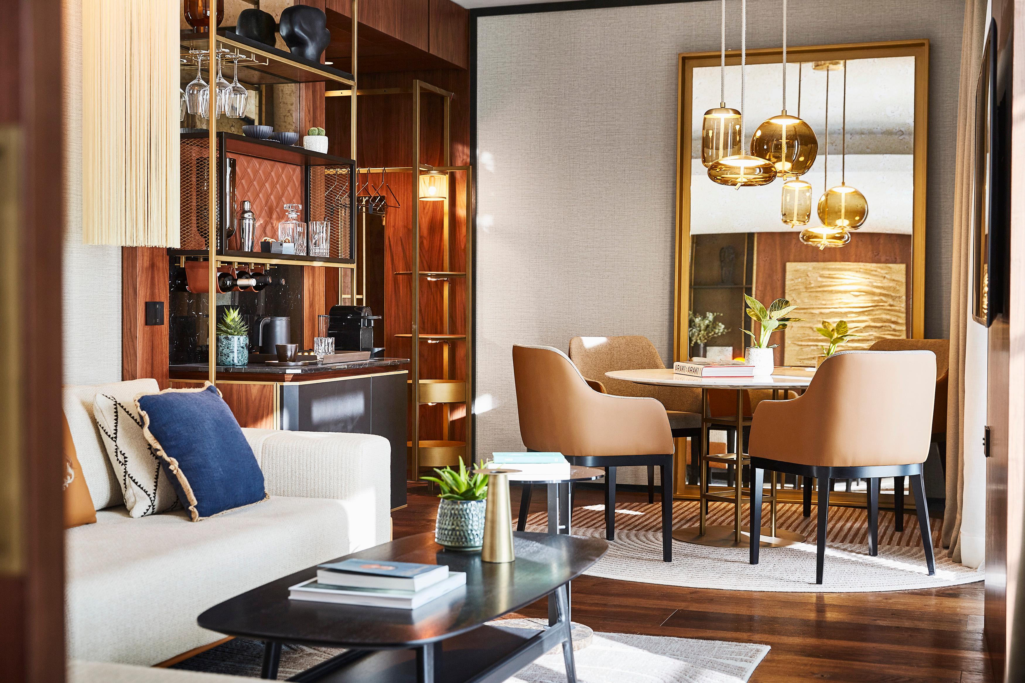 King Suite living room with mid-century decor and floor-to-ceiling windows