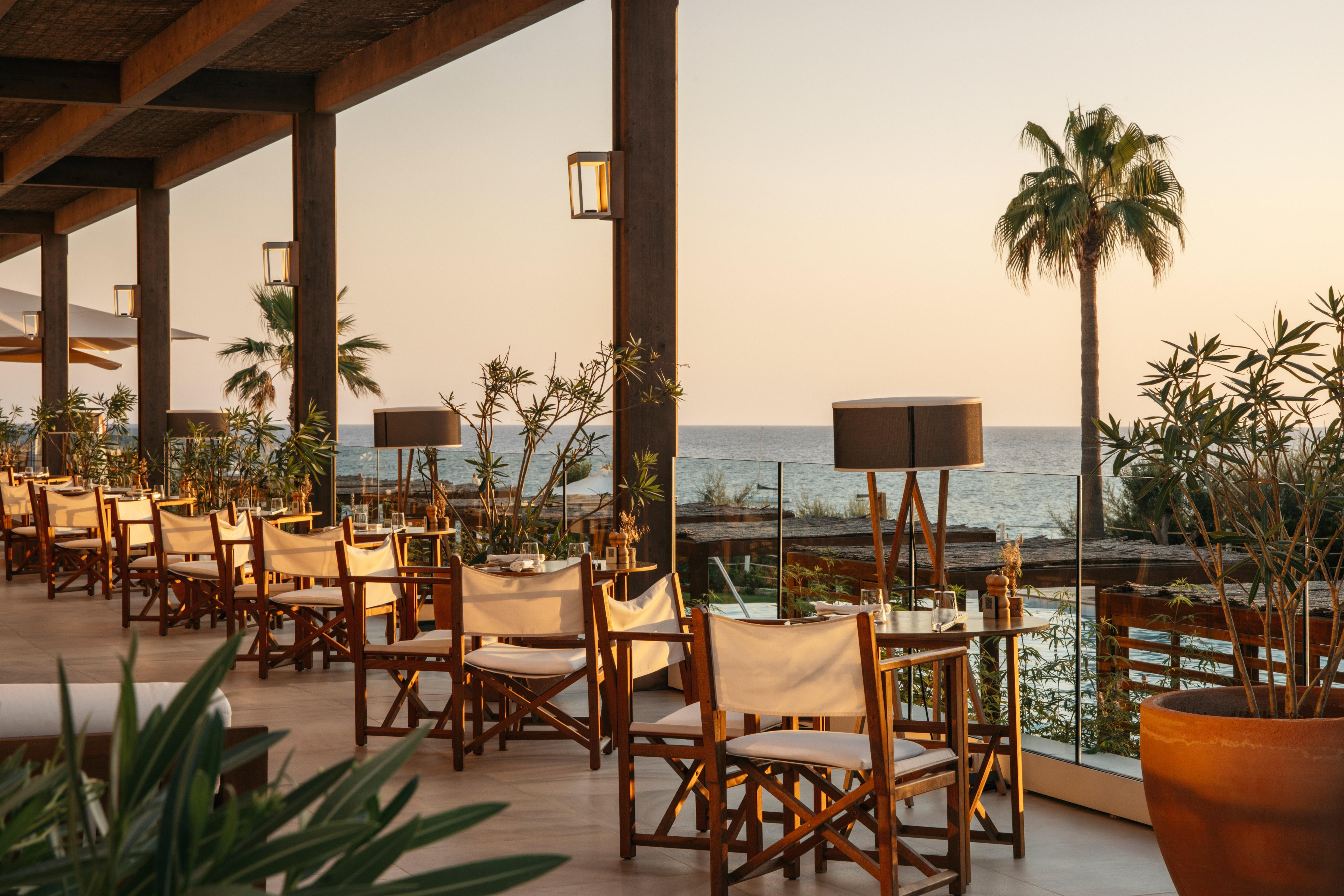 Nivi Restaurant outdoor oceanfront terrace serving authentic Menorcan paella