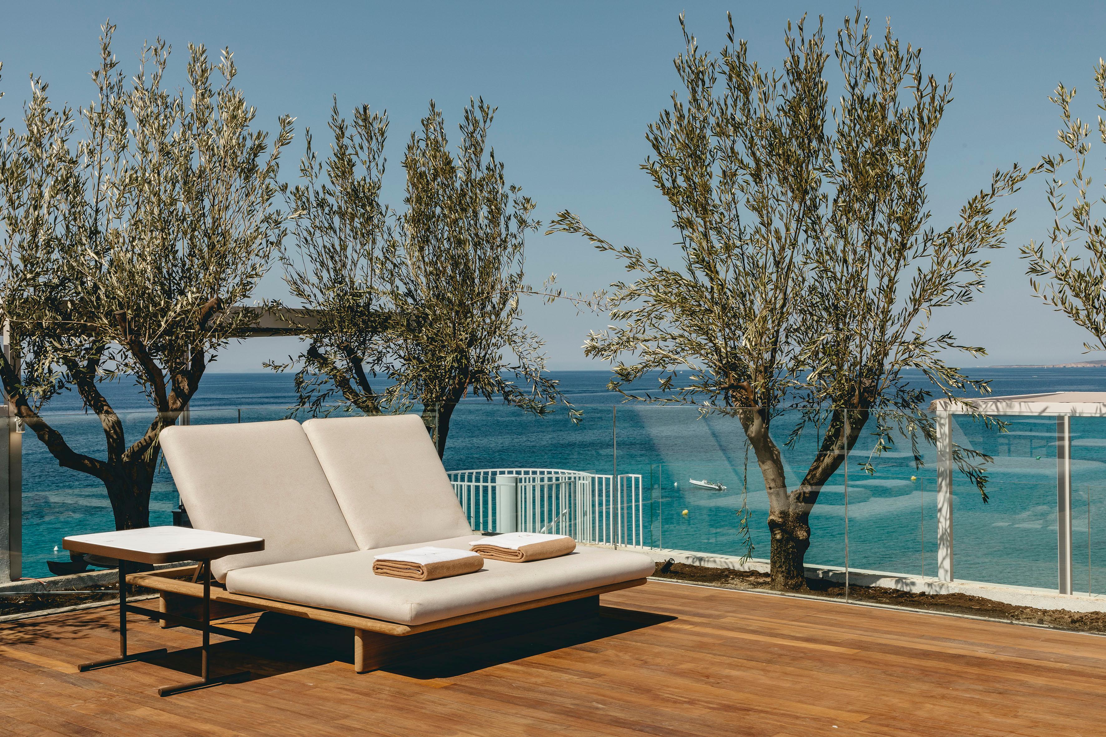Adults-only rooftop lounge pool and Bali beds overlooking Santo Tomas beach