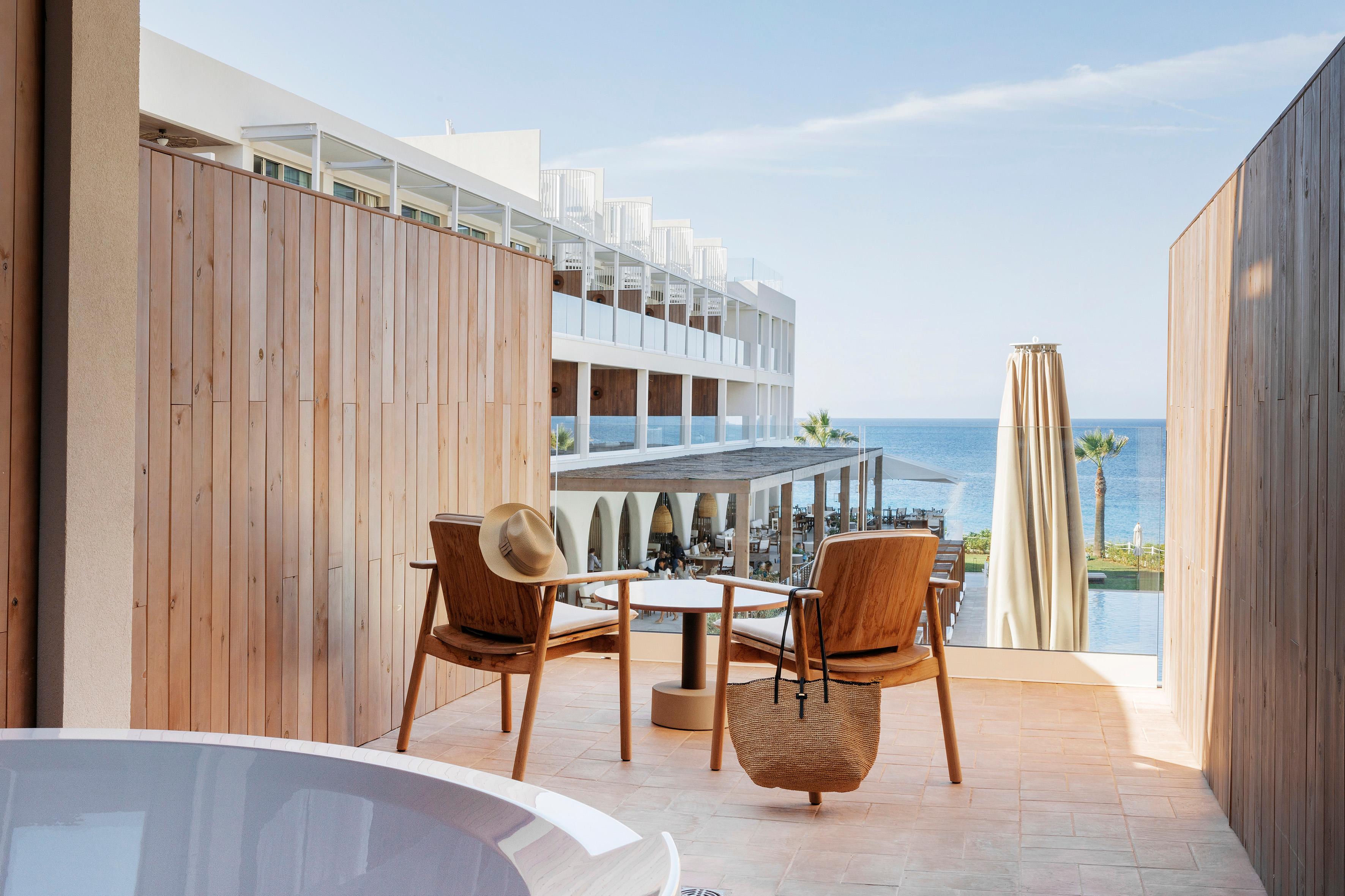 Ocean Suite featuring a private furnished terrace with outdoor soaking tub