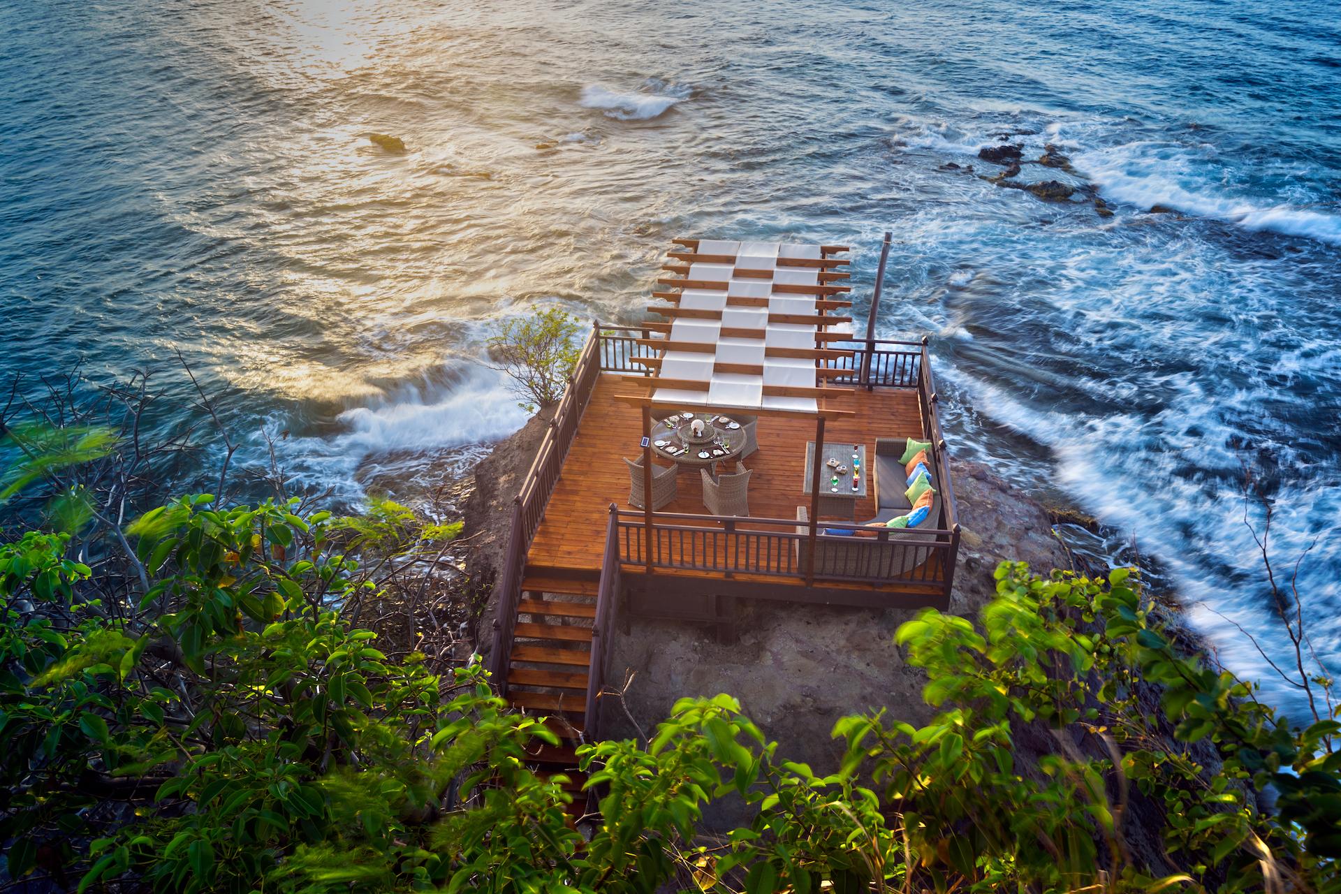 Rock Maison private ocean rock dining deck with champagne zip-line
