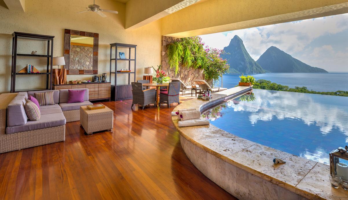 Private iridescent glass-tile infinity pool inside Moon Sanctuary