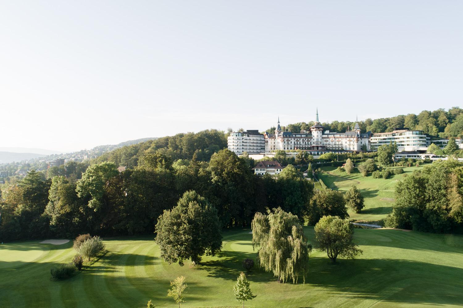 The Dolder Grand Aerial Drone View of Historic Castle and Modern Wings Overlooking Zurich and Alps