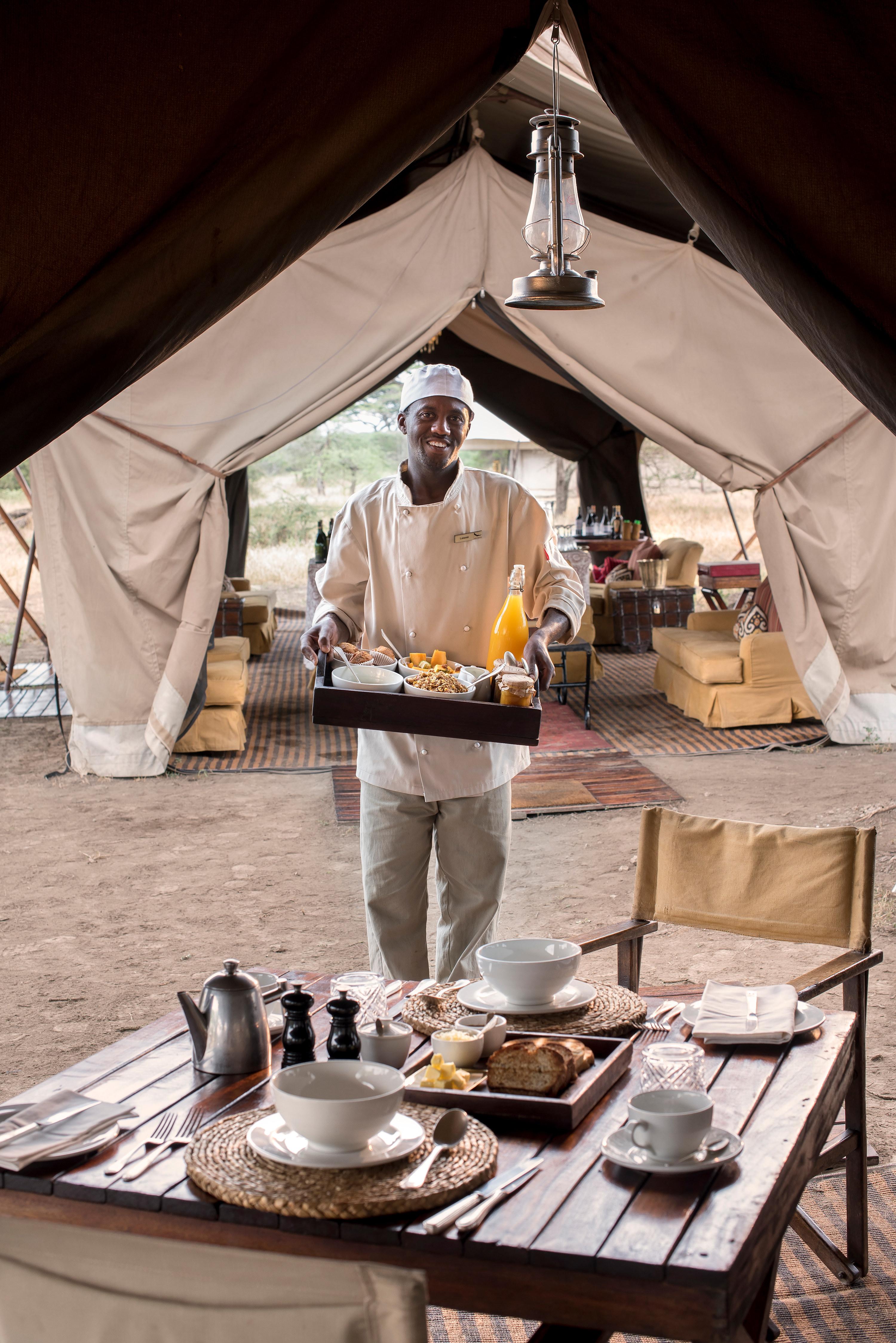 Butler Serving Breakfast in Dining Tent