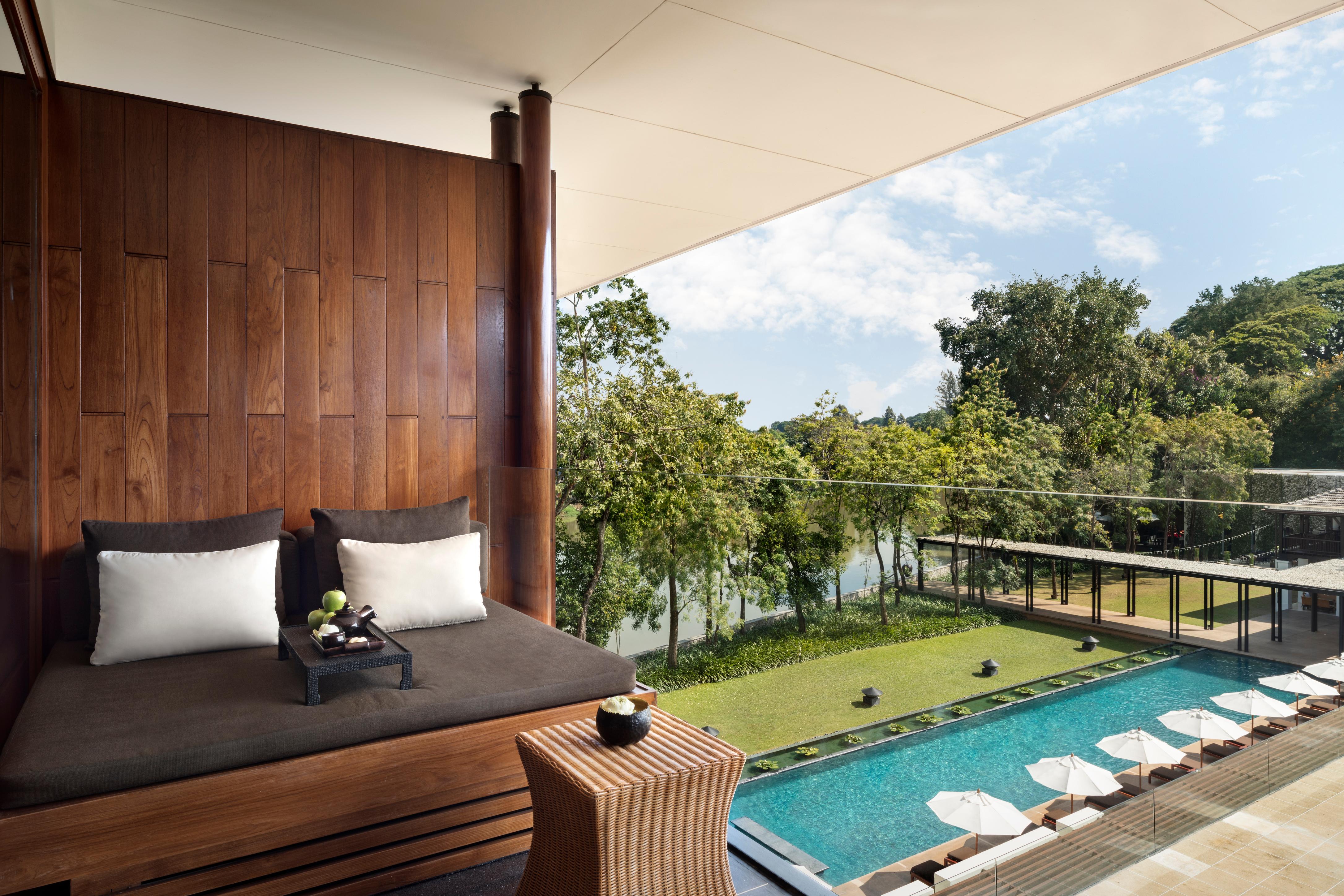 Deluxe River View Room private balcony with daybed