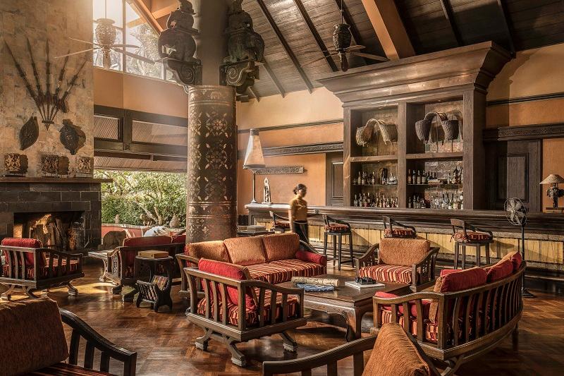 Elephant Bar open-air lounge overlooking jungle ridge at sunset