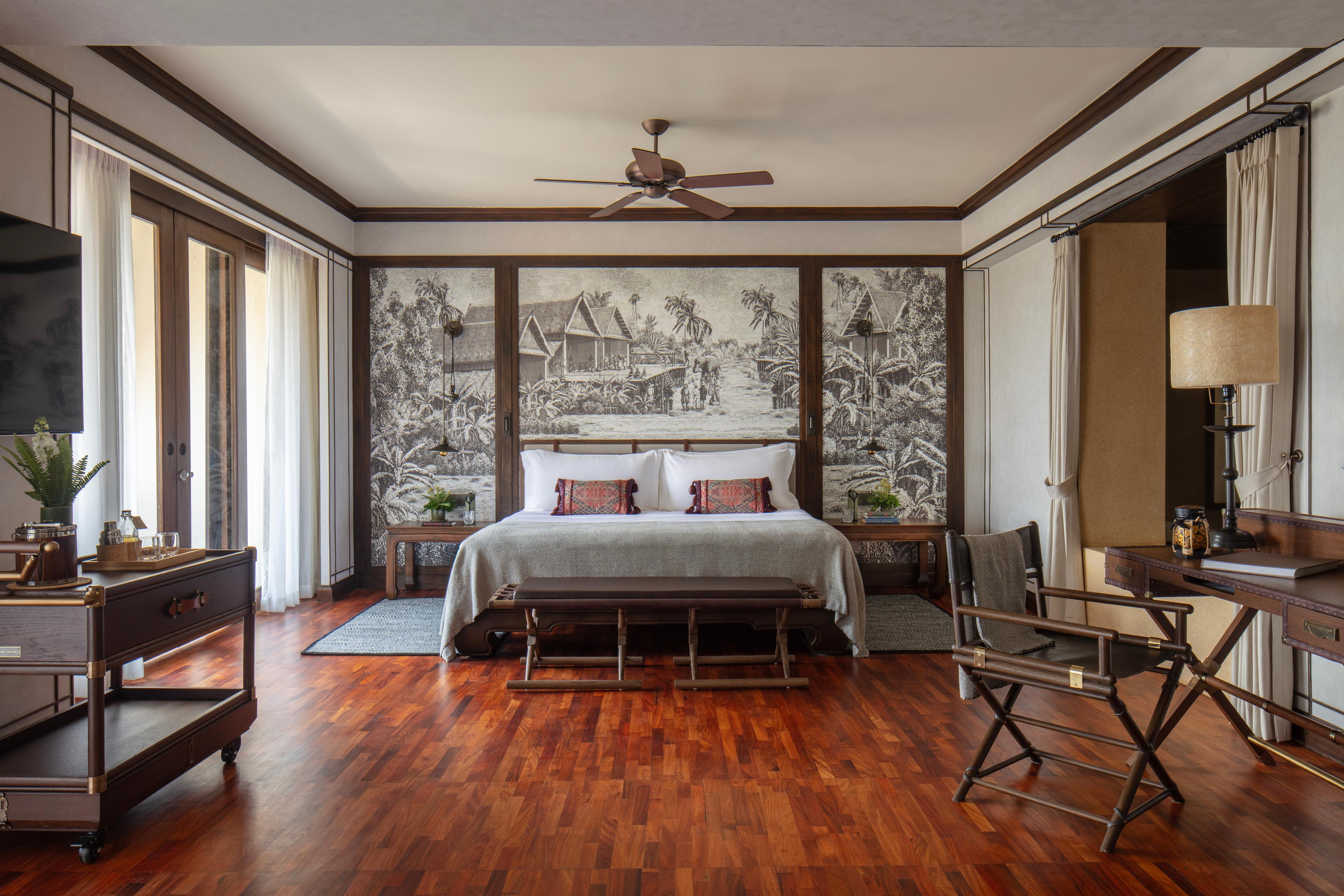 Mekong Explorer Suite master bedroom with teak furnishings
