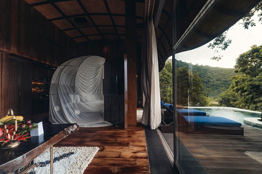 Bird’s Nest Pool Villa opulent bedroom and bathroom with panoramic rainforest vistas