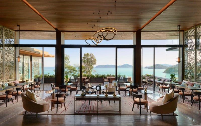 Yon Ocean House coastal dining room with floor-to-ceiling panoramic sea views