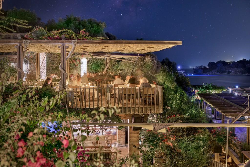 Open-air Nuxe Spa treatment pavilion in lush garden olive grove