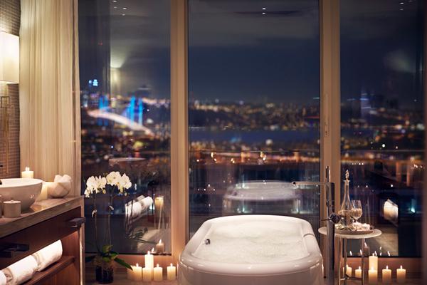 Opulent marble master bathroom with skyline soaking tub