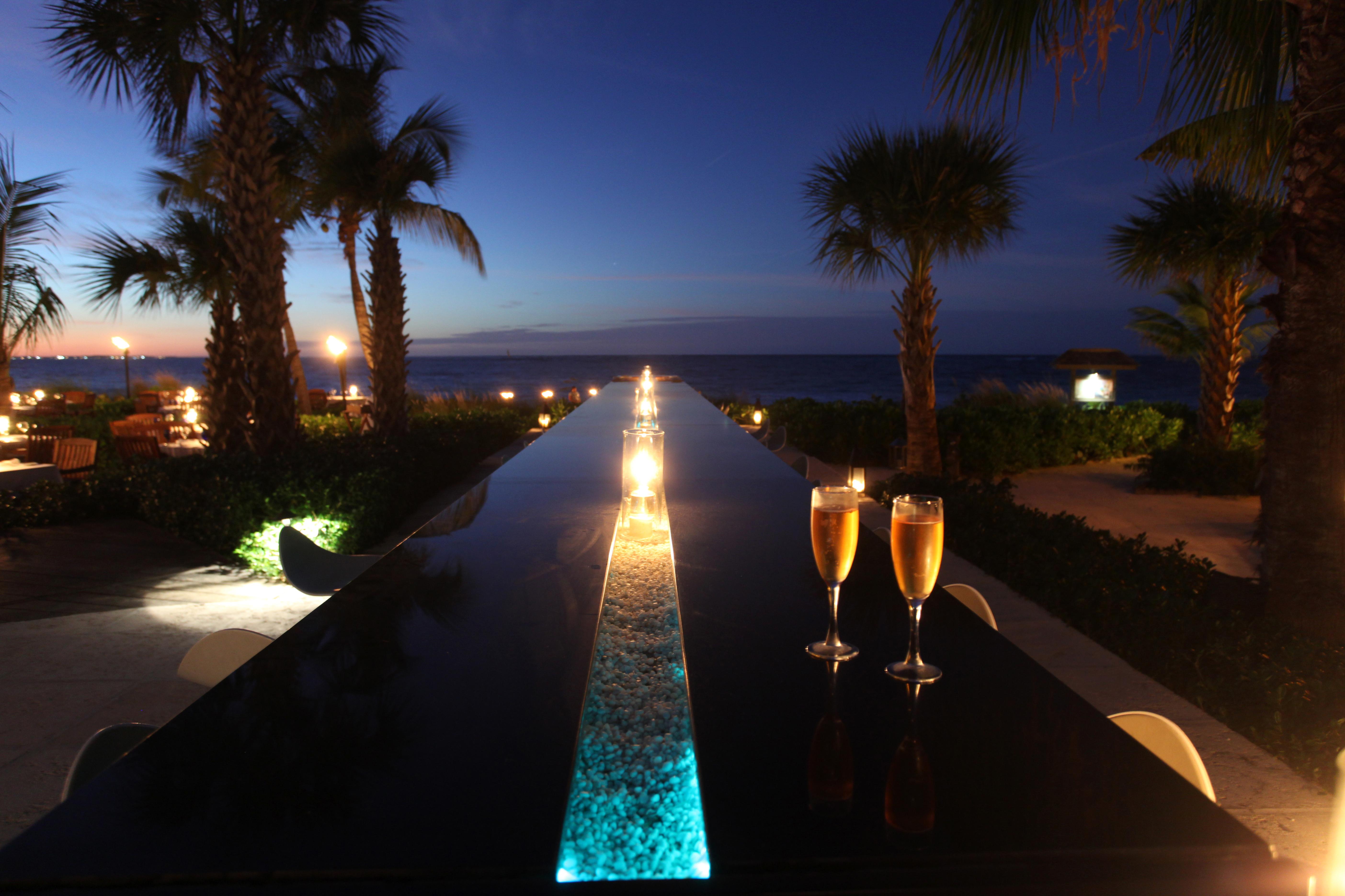 The 90-foot Infiniti Bar illuminated at night