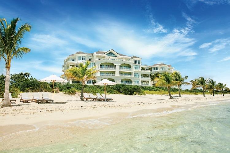 The illuminated Colonnade Pool and private daybeds at The Shore Club Turks and Caicos