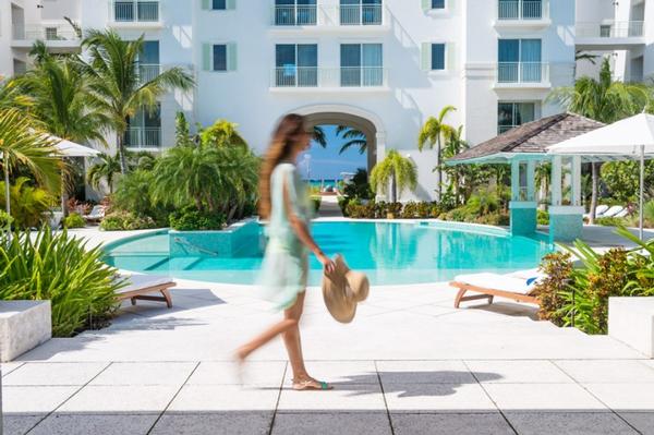 Oceanfront swimming pool surrounded by tropical gardens at West Bay Club Turks and Caicos