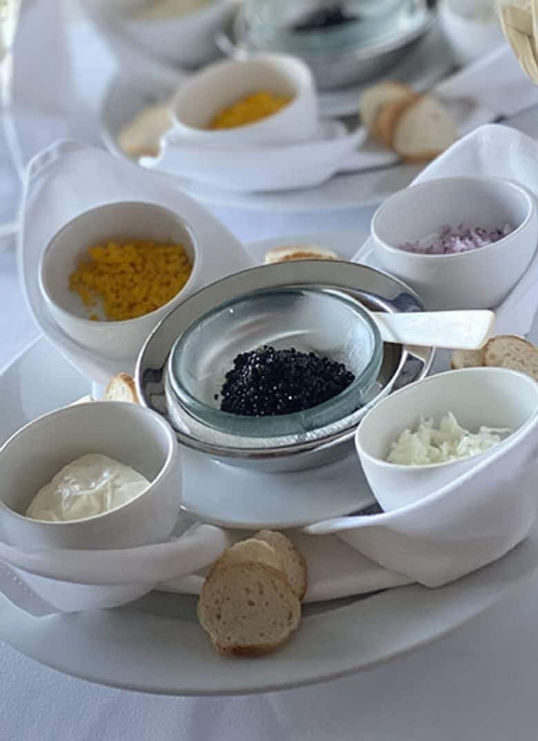 Seabourn signature Caviar in the Surf beach party with chilled champagne and caviar served on surfboards