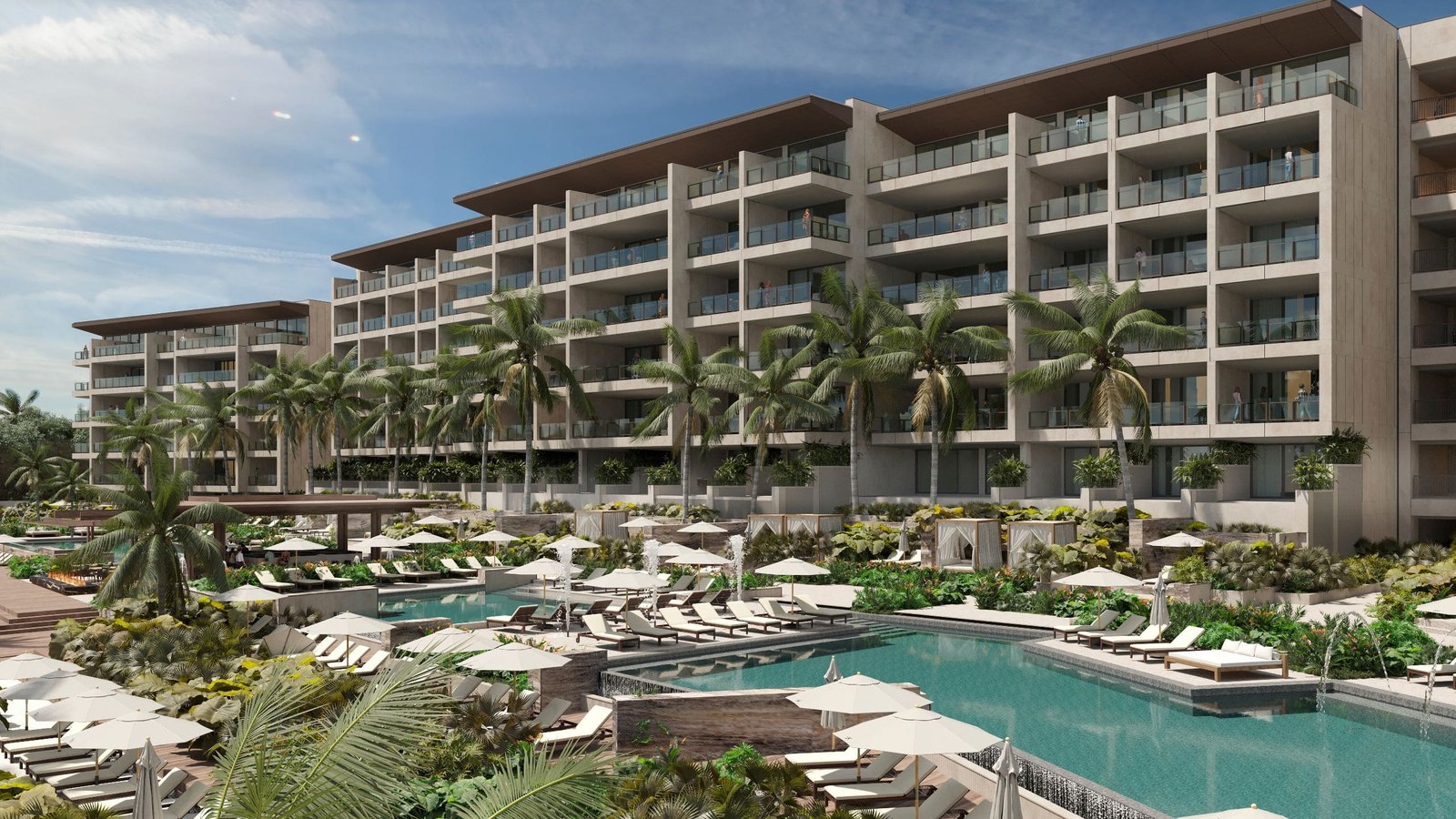 Multi-tiered cascading infinity pools facing the turquoise Caribbean Sea