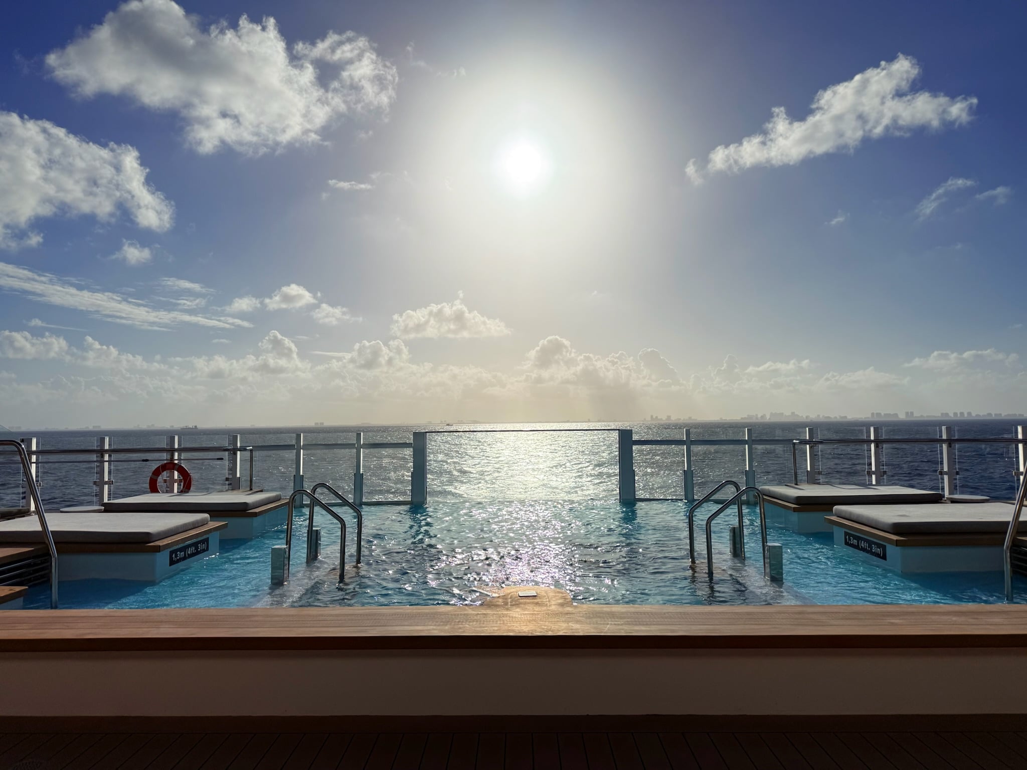 Sunset glowing over the infinity pool on Ilma