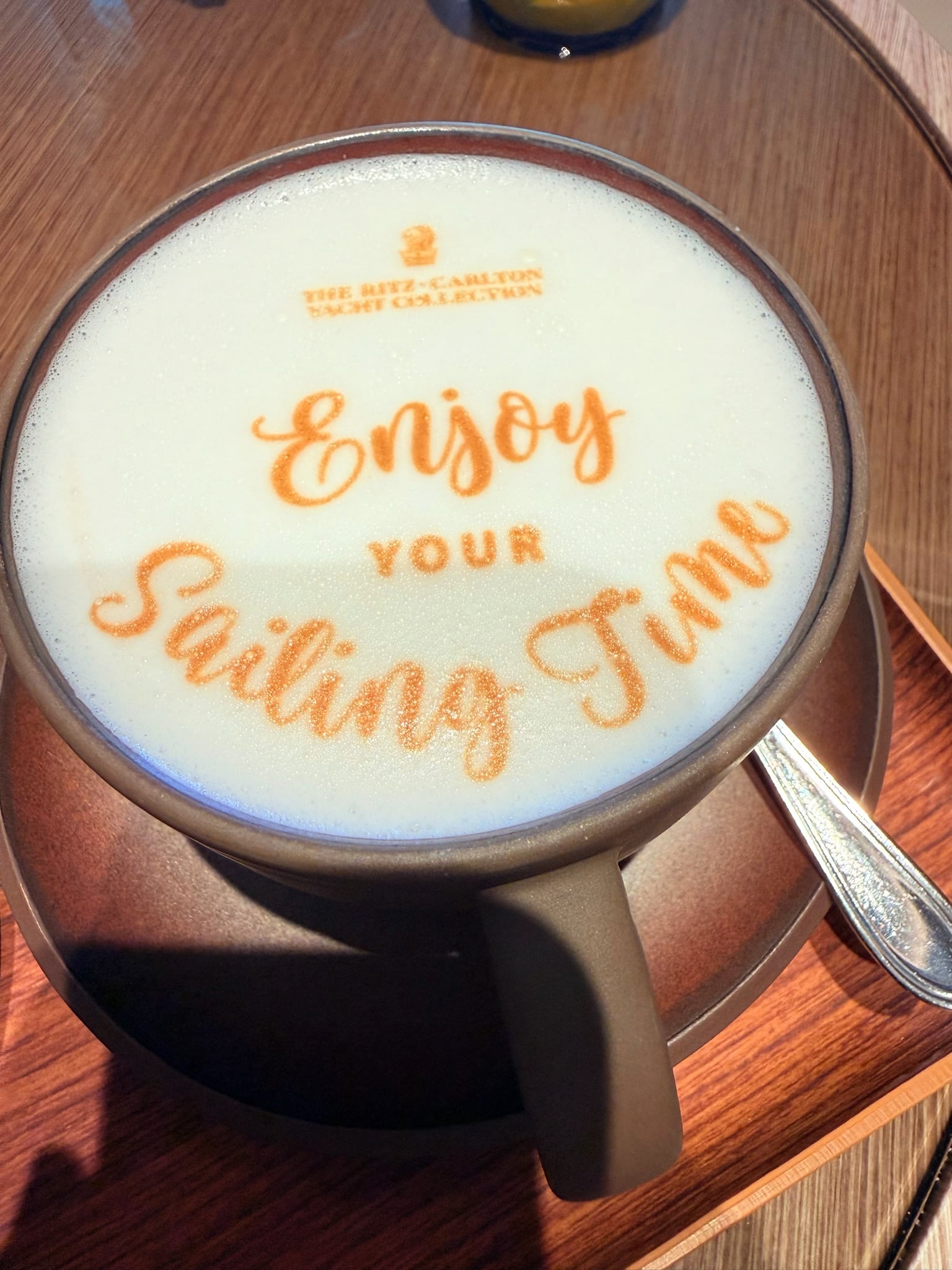 Barista custom foam latte art reading Enjoy Your Sailing Time aboard Ilma