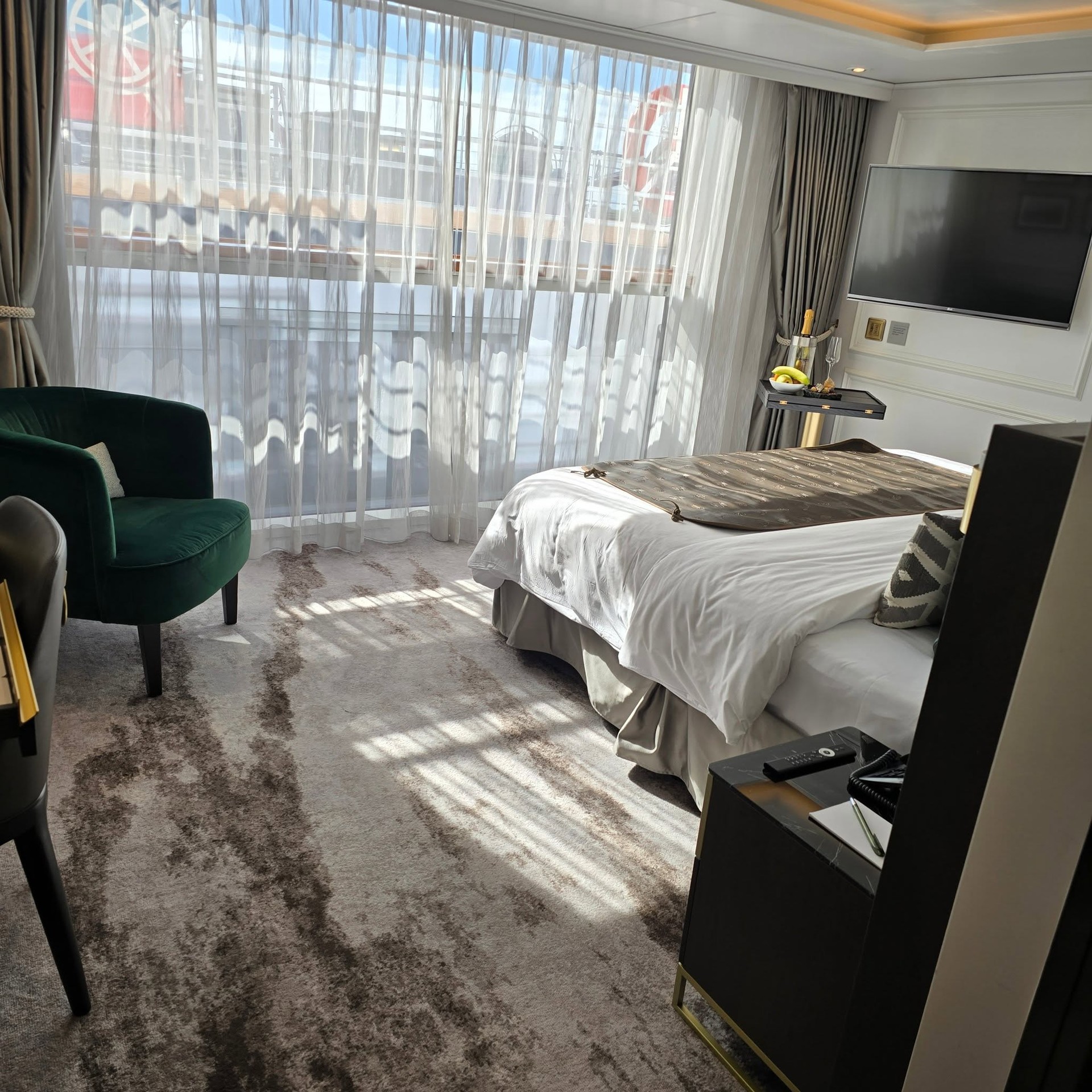 Master bedroom with King bed and sunlight from French balcony on Riverside Debussy