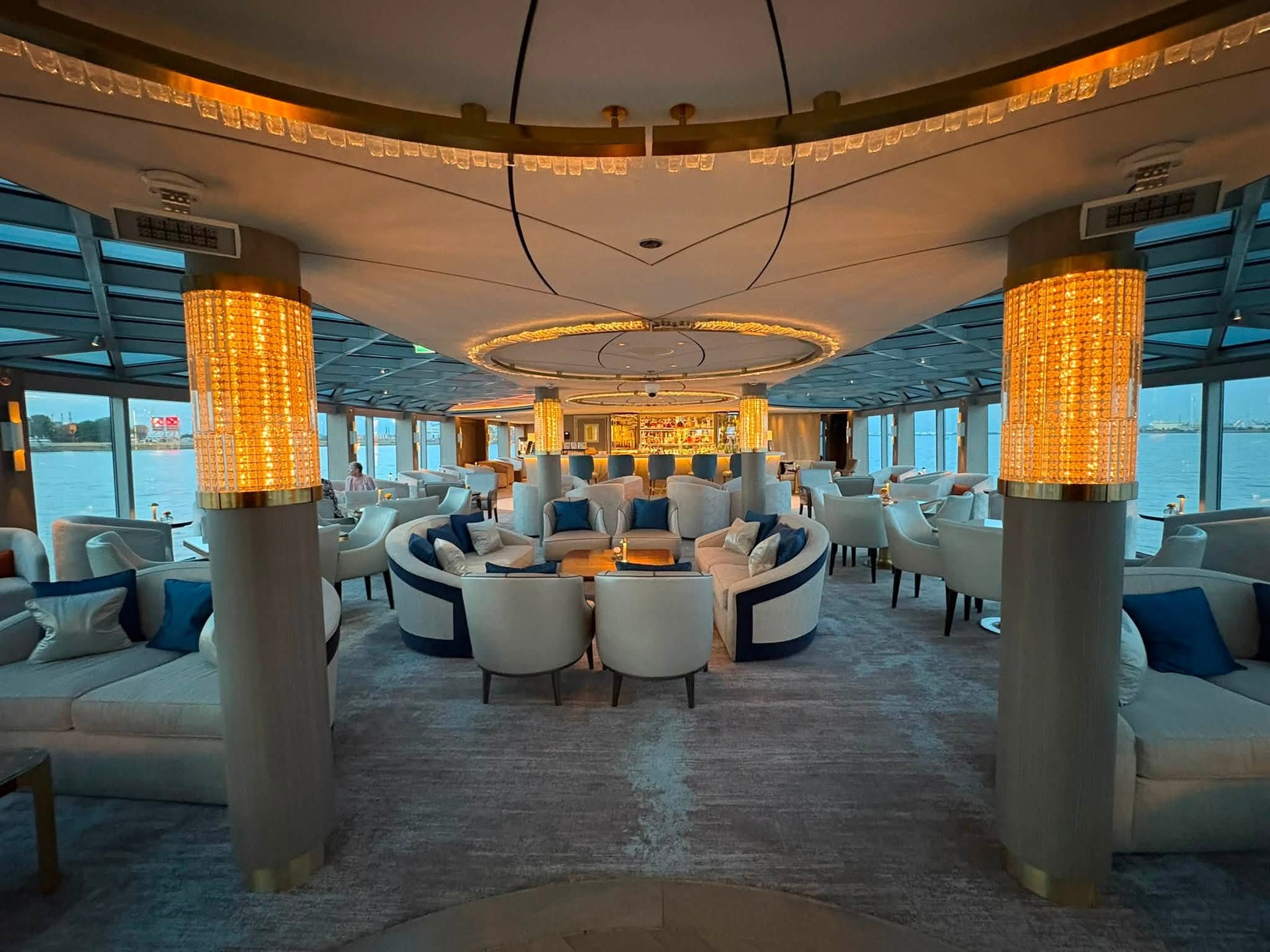 The panoramic observation lounge with fluted golden columns and 360-degree river windows