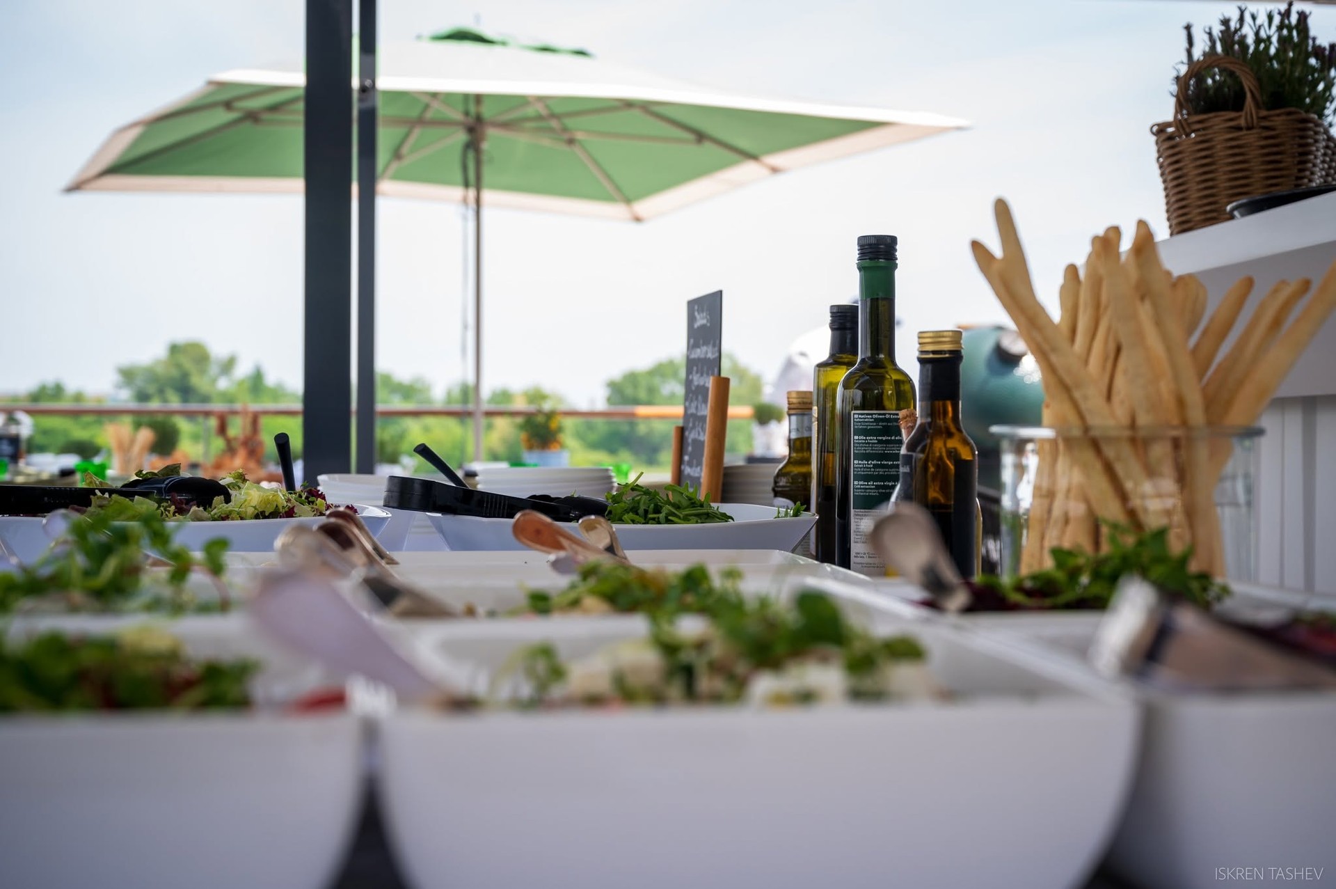 Fresh artisan salads, olive oils, and breadsticks at the Bistro food counter on Riverside Debussy