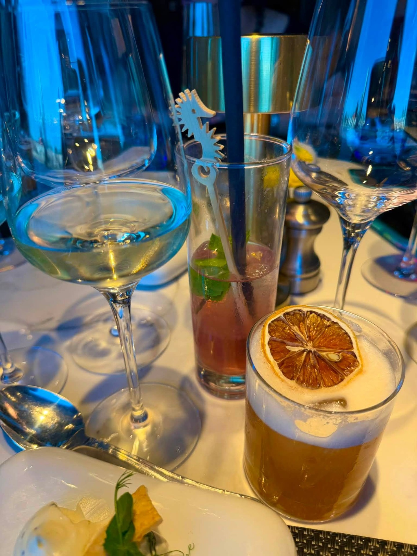 Handcrafted signature cocktails and dessert wine glasses in the ship lounge