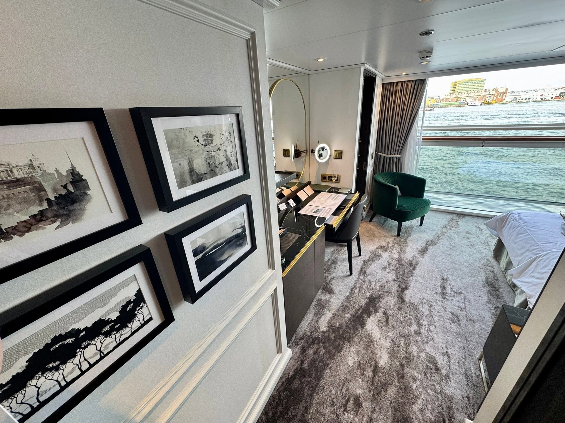 Suite writing desk with framed monochrome architectural prints on Riverside Debussy