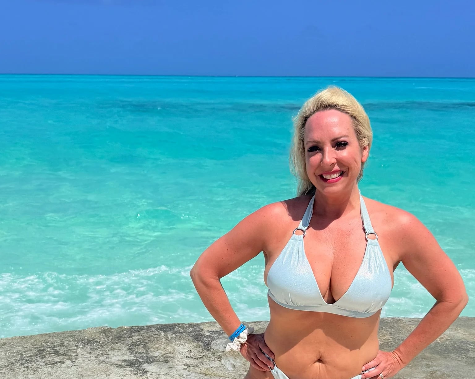 Pristine white sand beach and crystal clear waters of San Salvador Bahamas