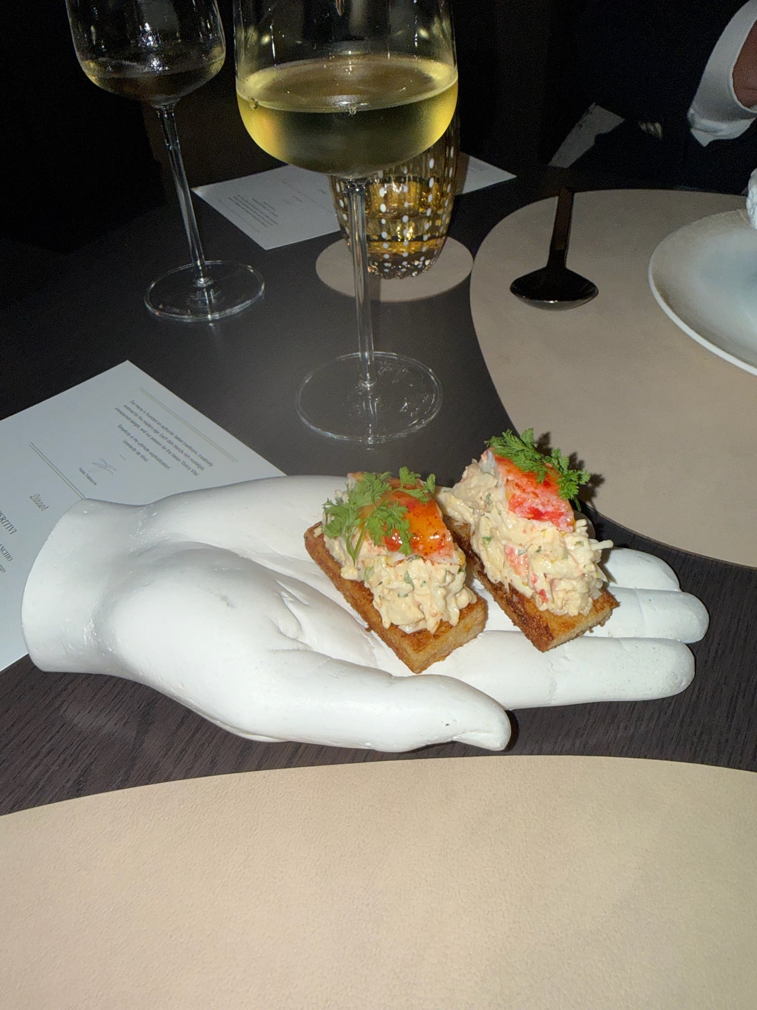 King crab roll served on an artisan sculpted porcelain hand at Seta