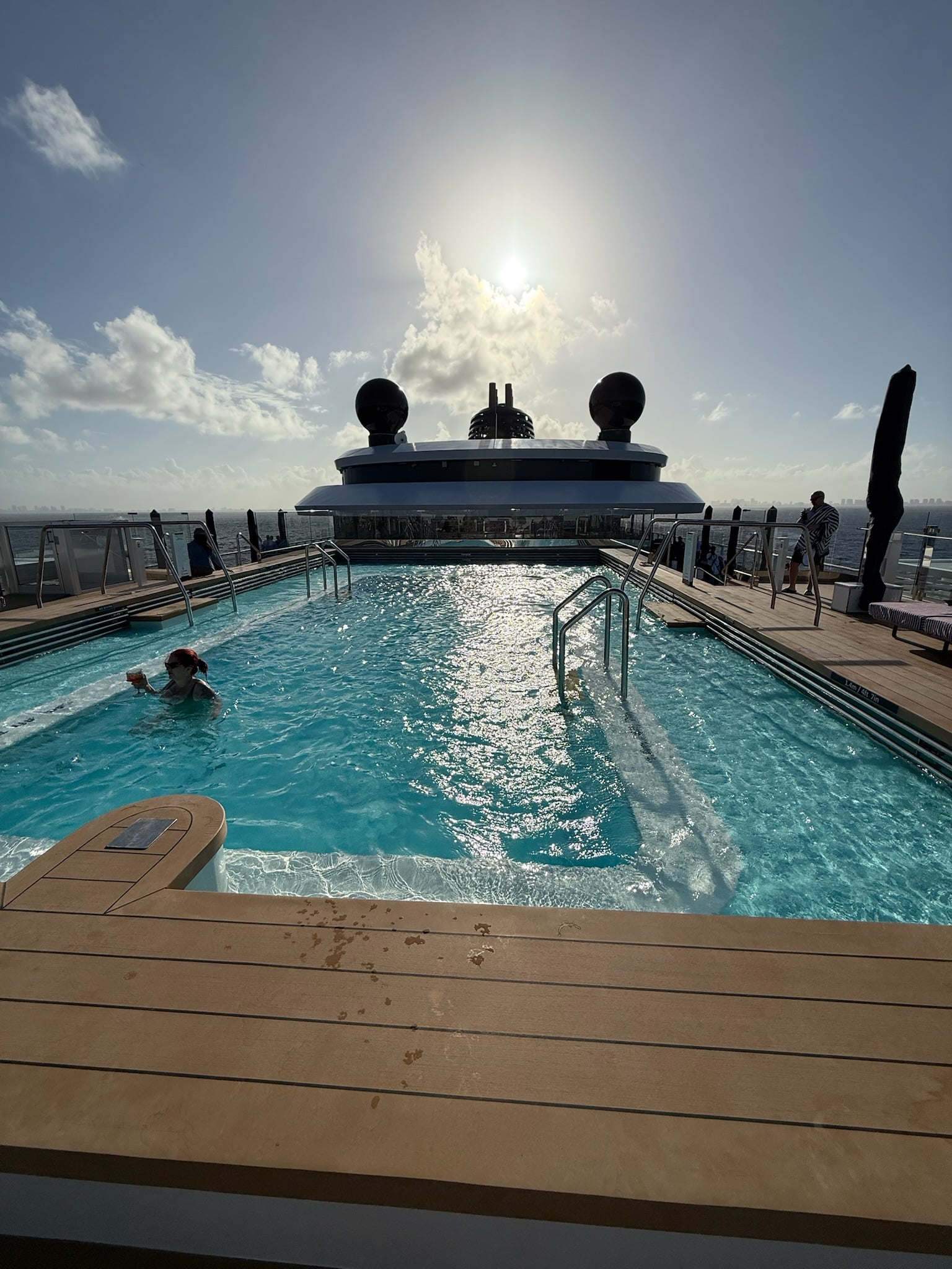 Main pool deck with loungers and daybeds on Ilma