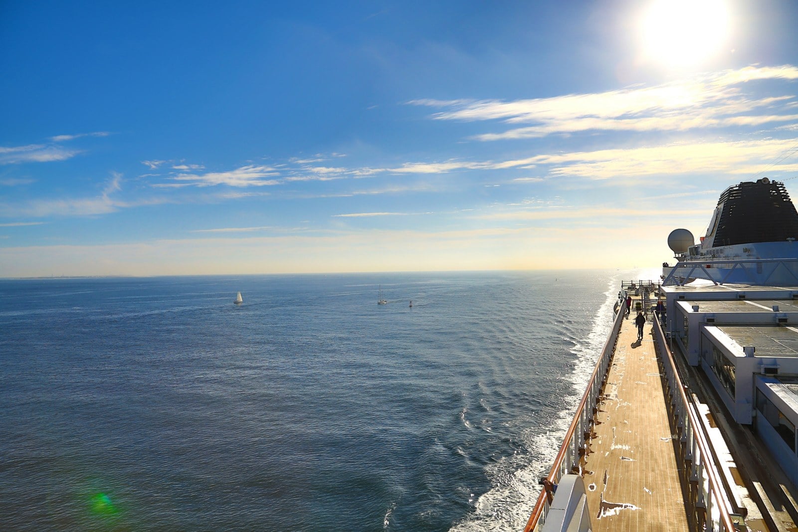 Expansive teak promenade deck on a Viking ocean ship during an open sea crossing