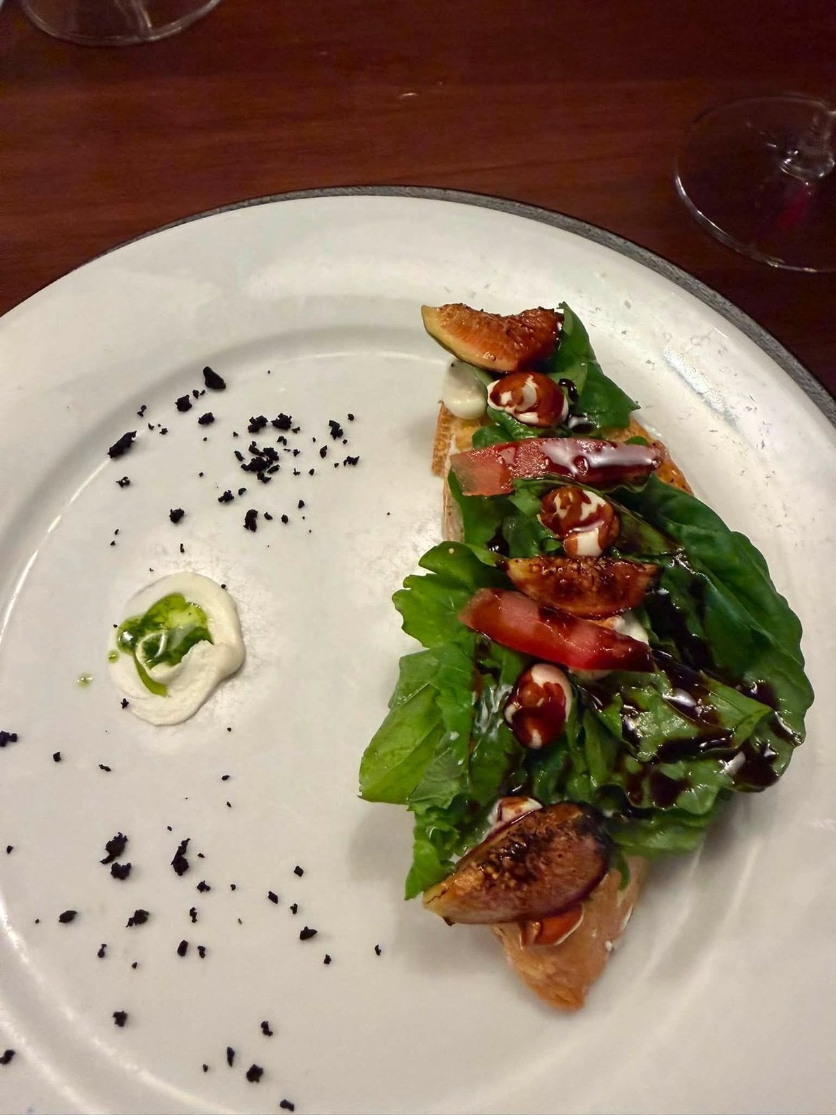 Gourmet fine dining culinary presentation with fresh figs and balsamic reduction at Dreams Playa Mujeres