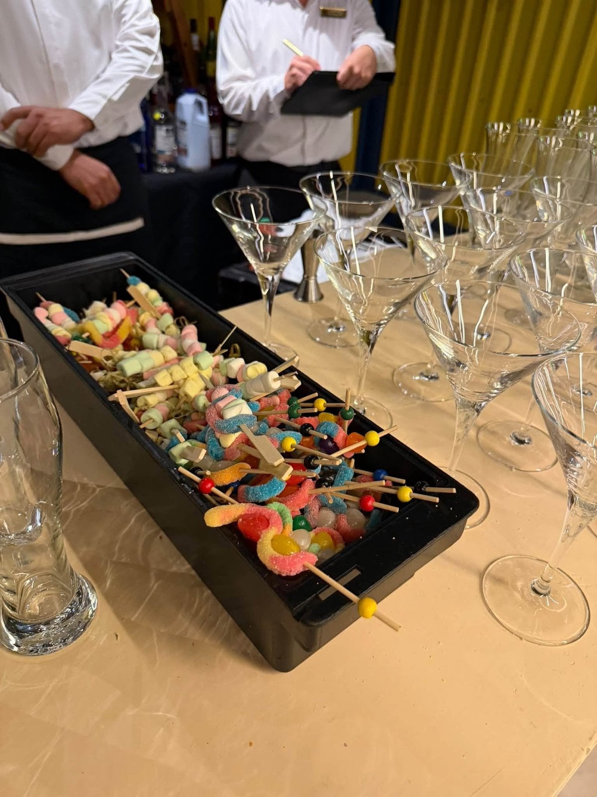 Vibrant candy skewer bar and tropical cocktail station at Dreams Playa Mujeres