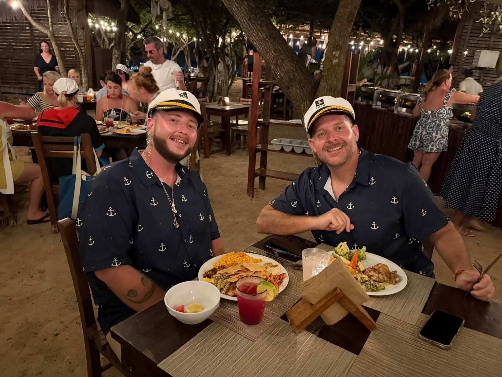 Advisors dining beachfront under the palms on Isla Mujeres with authentic Mexican cuisine
